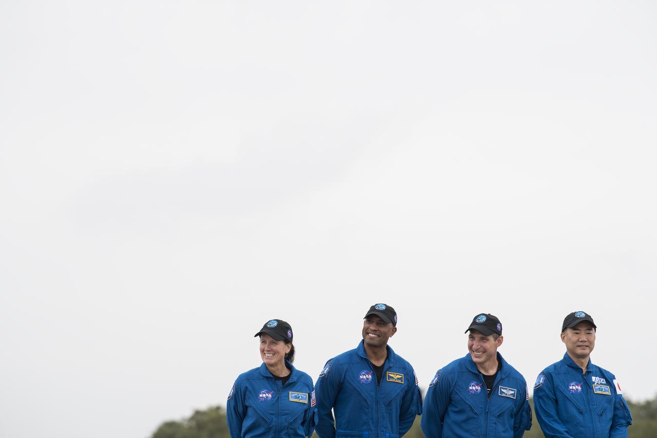 NASA astronauts Shannon Walker, left, Victor Glover, second from left, Mike Hopkins, second from right, and Japan Aerospace Exploration Agency (JAXA) astronaut Soichi Noguchi, right, are seen after arriving at the Launch and Landing Facility at NASA’s Kennedy Space Center ahead of SpaceX’s Crew-1 mission, Sunday, Nov. 8, 2020, in Florida. NASA’s SpaceX Crew-1 mission is the first operational mission of the SpaceX Crew Dragon spacecraft and Falcon 9 rocket to the International Space Station as part of the agency’s Commercial Crew Program. NASA astronauts Mike Hopkins, Victor Glover, and Shannon Walker, and astronaut Soichi Noguchi of the Japan Aerospace Exploration Agency (JAXA) are scheduled to launch at 7:49 p.m. EST on Saturday, Nov. 14, from Launch Complex 39A at the Kennedy Space Center. Photo Credit: (NASA/Joel Kowsky)