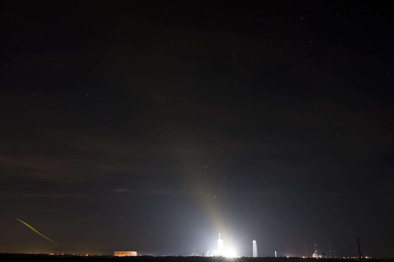 A SpaceX Falcon 9 rocket with the company's Crew Dragon spacecraft onboard is seen, in this 30 second exposure, illuminated by spotlights on the launch pad at Launch Complex 39A as preparations continue for the Crew-1 mission, Thursday, Nov. 12, 2020, at NASA’s Kennedy Space Center in Florida. NASA’s SpaceX Crew-1 mission is the first crew rotation mission of the SpaceX Crew Dragon spacecraft and Falcon 9 rocket to the International Space Station as part of the agency’s Commercial Crew Program. NASA astronauts Mike Hopkins, Victor Glover, and Shannon Walker, and astronaut Soichi Noguchi of the Japan Aerospace Exploration Agency (JAXA) are scheduled to launch at 7:49 p.m. EST on Saturday, Nov. 14, from Launch Complex 39A at the Kennedy Space Center. Photo Credit: (NASA/Joel Kowsky)