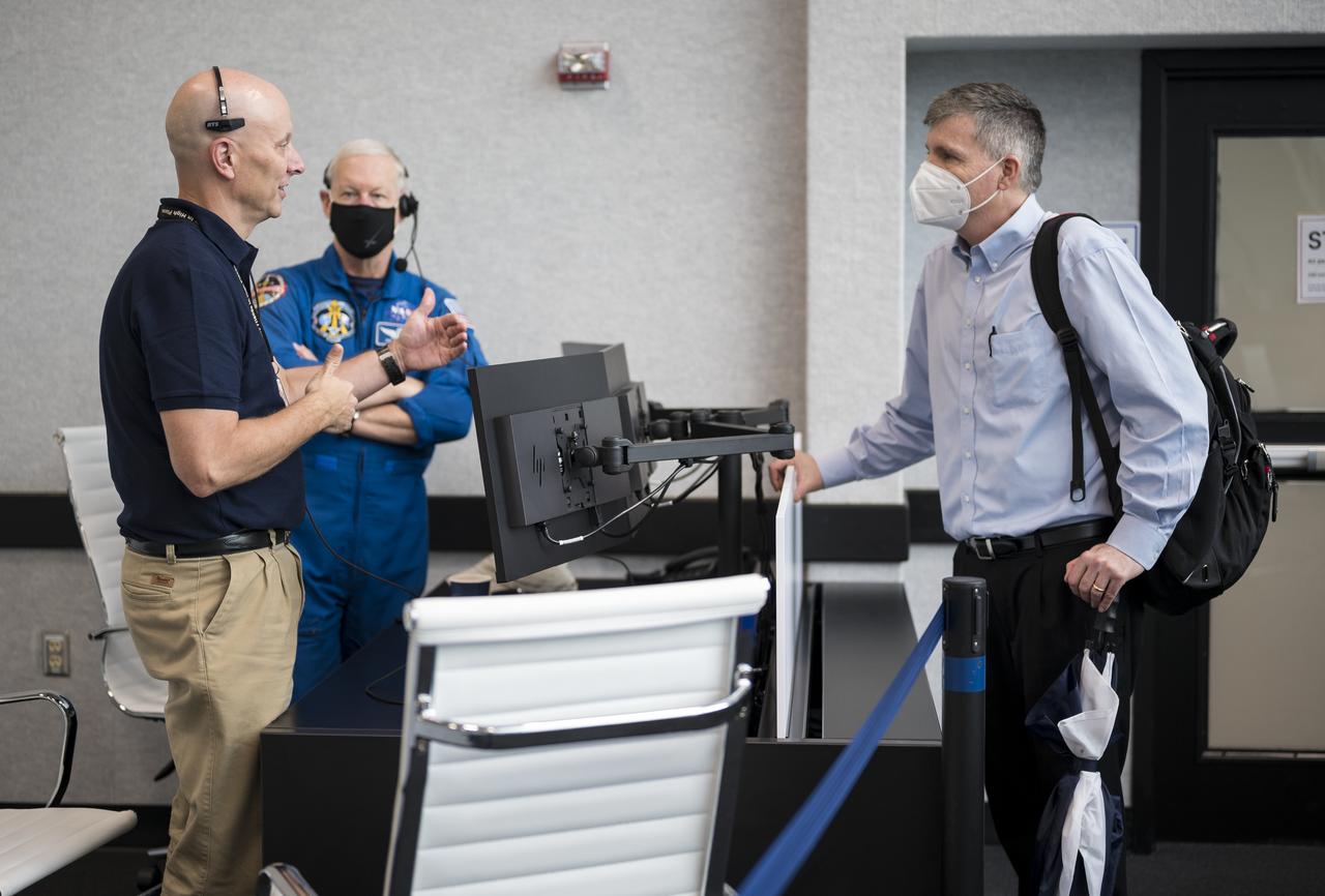 Stephen Koerner, director of the Flight Operations Directorate at NASA’s Johnson Space Center, left, speaks with Steve Stich, manager of NASA’s Commercial Crew Program, right, during a dress rehearsal in preparation for the launch of a SpaceX Falcon 9 rocket carrying the company's Crew Dragon spacecraft on NASA’s SpaceX Crew-1 mission with NASA astronauts Mike Hopkins, Victor Glover, Shannon Walker, and Japan Aerospace Exploration Agency (JAXA) astronaut Soichi Noguchi onboard, Thursday, Nov. 12, 2020, in firing room four of the Launch Control Center at NASA’s Kennedy Space Center in Florida. NASA’s SpaceX Crew-1 mission is the first crew rotation mission of the SpaceX Crew Dragon spacecraft and Falcon 9 rocket to the International Space Station as part of the agency’s Commercial Crew Program. Hopkins, Glover, Walker, and Noguchi are scheduled to launch at 7:49 p.m. EST on Saturday, Nov. 14, from Launch Complex 39A at the Kennedy Space Center. Photo Credit: (NASA/Aubrey Gemignani)