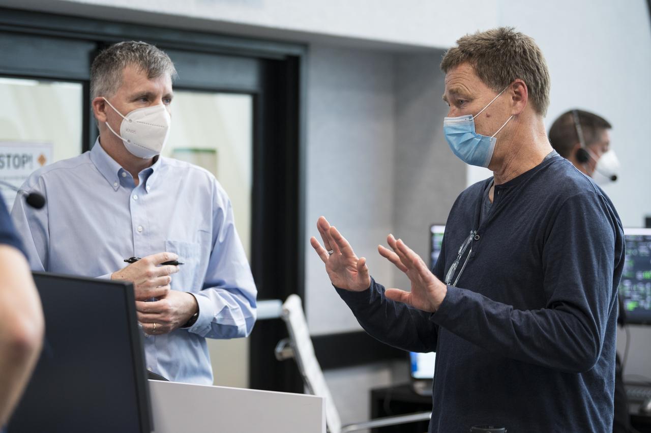 Hans Koenigsmann, vice president for Build and Flight Reliability at SpaceX speaks with Steve Stich, manager of NASA’s Commercial Crew Program, during a dress rehearsal in preparation for the launch of a SpaceX Falcon 9 rocket carrying the company's Crew Dragon spacecraft on NASA’s SpaceX Crew-1 mission with NASA astronauts Mike Hopkins, Victor Glover, Shannon Walker, and Japan Aerospace Exploration Agency (JAXA) astronaut Soichi Noguchi onboard, Thursday, Nov. 12, 2020, in firing room four of the Launch Control Center at NASA’s Kennedy Space Center in Florida. NASA’s SpaceX Crew-1 mission is the first crew rotation mission of the SpaceX Crew Dragon spacecraft and Falcon 9 rocket to the International Space Station as part of the agency’s Commercial Crew Program. Hopkins, Glover, Walker, and Noguchi are scheduled to launch at 7:49 p.m. EST on Saturday, Nov. 14, from Launch Complex 39A at the Kennedy Space Center. Photo Credit: (NASA/Aubrey Gemignani)