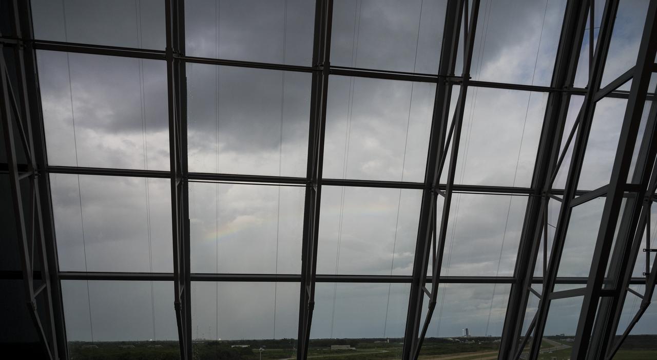 A rainbow is seen in the sky over the SpaceX Falcon 9 rocket carrying the company's Crew Dragon spacecraft during a dress rehearsal in preparation for launch of NASA’s SpaceX Crew-1 mission with NASA astronauts Mike Hopkins, Victor Glover, Shannon Walker, and Japan Aerospace Exploration Agency (JAXA) astronaut Soichi Noguchi onboard, Thursday, Nov. 12, 2020, in firing room four of the Launch Control Center at NASA’s Kennedy Space Center in Florida. NASA’s SpaceX Crew-1 mission is the first crew rotation mission of the SpaceX Crew Dragon spacecraft and Falcon 9 rocket to the International Space Station as part of the agency’s Commercial Crew Program. Hopkins, Glover, Walker, and Noguchi are scheduled to launch at 7:49 p.m. EST on Saturday, Nov. 14, from Launch Complex 39A at the Kennedy Space Center. Photo Credit: (NASA/Aubrey Gemignani)