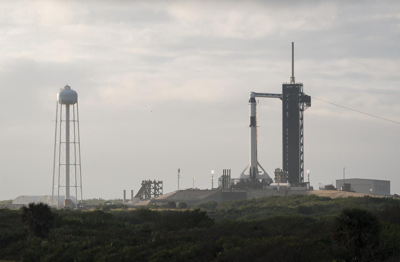A SpaceX Falcon 9 rocket with the company's Crew Dragon spacecraft onboard is seen on the launch pad at Launch Complex 39A as preparations continue for the Crew-1 mission, Friday, Nov. 13, 2020, at NASA’s Kennedy Space Center in Florida. NASA’s SpaceX Crew-1 mission is the first crew rotational mission of the SpaceX Crew Dragon spacecraft and Falcon 9 rocket to the International Space Station as part of the agency’s Commercial Crew Program. NASA astronauts Mike Hopkins, Victor Glover, and Shannon Walker, and astronaut Soichi Noguchi of the Japan Aerospace Exploration Agency (JAXA) are scheduled to launch at 7:49 p.m. EST on Saturday, Nov. 14, from Launch Complex 39A at the Kennedy Space Center. Photo Credit: (NASA/Aubrey Gemignani)
