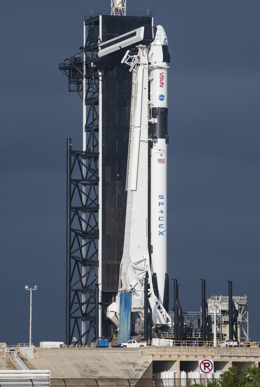 A SpaceX Falcon 9 rocket with the company's Crew Dragon spacecraft onboard is seen on the launch pad at Launch Complex 39A as preparations continue for the Crew-1 mission, Friday, Nov. 13, 2020, at NASA’s Kennedy Space Center in Florida. NASA’s SpaceX Crew-1 mission is the first crew rotational mission of the SpaceX Crew Dragon spacecraft and Falcon 9 rocket to the International Space Station as part of the agency’s Commercial Crew Program. NASA astronauts Mike Hopkins, Victor Glover, and Shannon Walker, and astronaut Soichi Noguchi of the Japan Aerospace Exploration Agency (JAXA) are scheduled to launch at 7:49 p.m. EST on Saturday, Nov. 14, from Launch Complex 39A at the Kennedy Space Center. Photo Credit: (NASA/\3030994#1\)