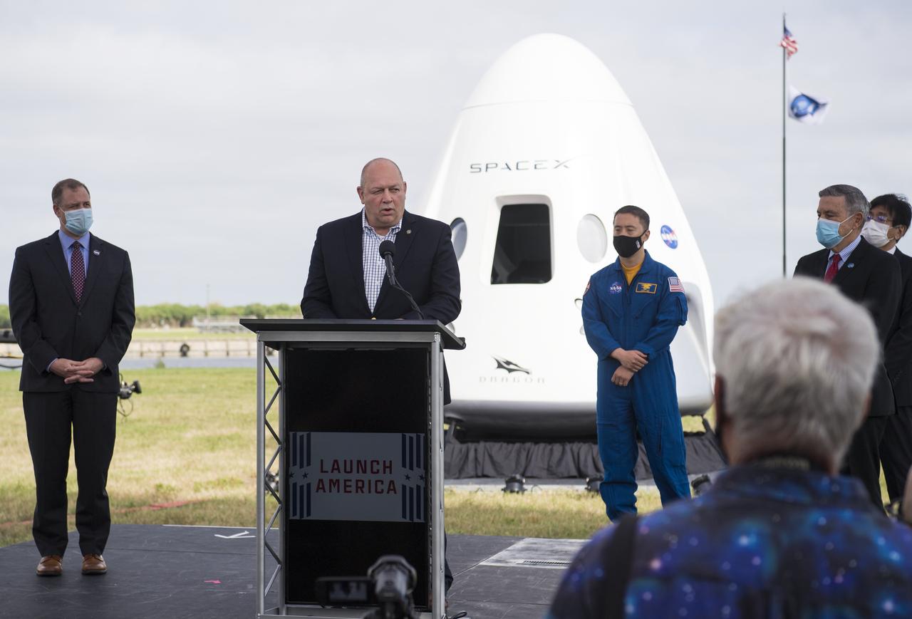 FAA Administrator Stephen Dickson, center, speaks to members of the media during a press conference ahead of the Crew-1 launch, Friday, Nov. 13, 2020, at NASA’s Kennedy Space Center in Florida. NASA’s SpaceX Crew-1 mission is the first crew rotation mission of the SpaceX Crew Dragon spacecraft and Falcon 9 rocket to the International Space Station as part of the agency’s Commercial Crew Program. NASA astronauts Mike Hopkins, Victor Glover, and Shannon Walker, and astronaut Soichi Noguchi of the Japan Aerospace Exploration Agency (JAXA) are scheduled to launch at 7:49 p.m. EST on Saturday, Nov. 14, from Launch Complex 39A at the Kennedy Space Center.  Photo Credit: (NASA/Joel Kowsky)