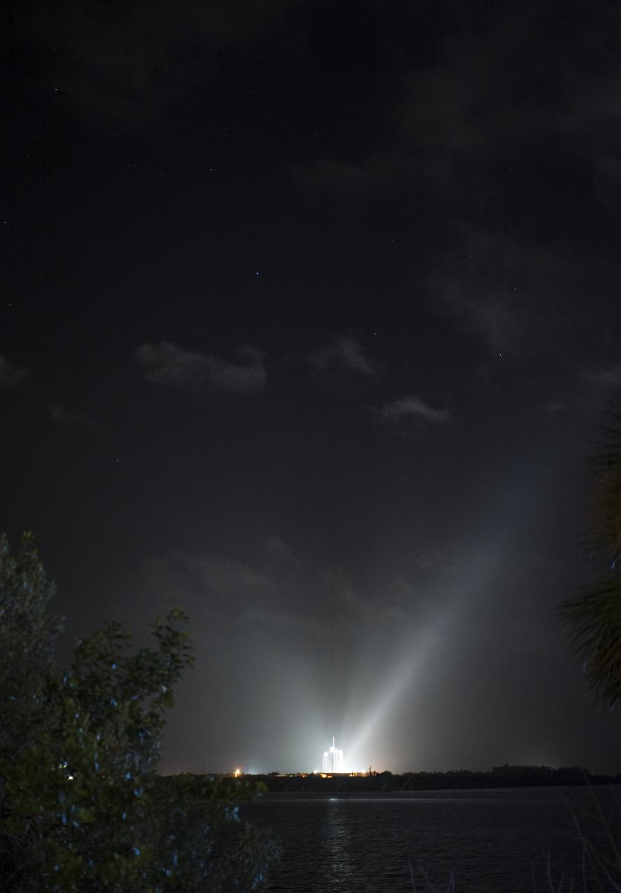 A SpaceX Falcon 9 rocket with the company's Crew Dragon spacecraft onboard is seen illuminated by spotlights on the launch pad at Launch Complex 39A as preparations continue for the Crew-1 mission, Friday, Nov. 13, 2020, at NASA’s Kennedy Space Center in Florida. NASA’s SpaceX Crew-1 mission is the first crew rotation mission of the SpaceX Crew Dragon spacecraft and Falcon 9 rocket to the International Space Station as part of the agency’s Commercial Crew Program. NASA astronauts Mike Hopkins, Victor Glover, and Shannon Walker, and astronaut Soichi Noguchi of the Japan Aerospace Exploration Agency (JAXA) are scheduled to launch at 7:27 p.m. EST on Sunday, Nov. 15, from Launch Complex 39A at the Kennedy Space Center. Photo Credit: (NASA/Joel Kowsky)