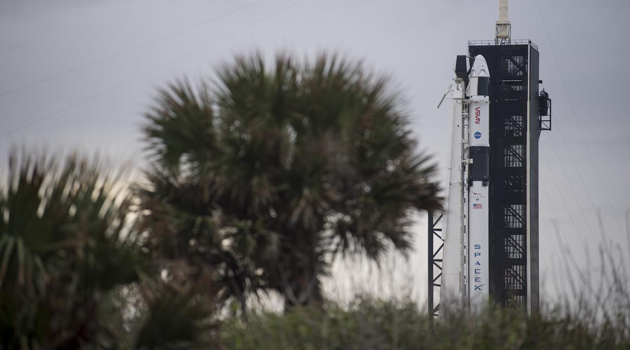 A SpaceX Falcon 9 rocket with the company's Crew Dragon spacecraft onboard is seen on the launch pad at Launch Complex 39A as preparations continue for the Crew-1 mission, Saturday, Nov. 14, 2020, at NASA’s Kennedy Space Center in Florida. NASA’s SpaceX Crew-1 mission is the first crew rotation mission of the SpaceX Crew Dragon spacecraft and Falcon 9 rocket to the International Space Station as part of the agency’s Commercial Crew Program. NASA astronauts Mike Hopkins, Victor Glover, and Shannon Walker, and astronaut Soichi Noguchi of the Japan Aerospace Exploration Agency (JAXA) are scheduled to launch at 7:27 p.m. EST on Sunday, Nov. 15, from Launch Complex 39A at the Kennedy Space Center. Photo Credit: (NASA/Joel Kowsky)