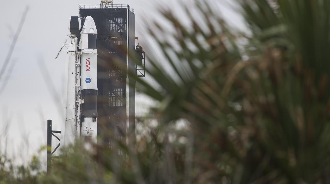 A SpaceX Falcon 9 rocket with the company's Crew Dragon spacecraft onboard is seen on the launch pad at Launch Complex 39A as preparations continue for the Crew-1 mission, Saturday, Nov. 14, 2020, at NASA’s Kennedy Space Center in Florida. NASA’s SpaceX Crew-1 mission is the first crew rotation mission of the SpaceX Crew Dragon spacecraft and Falcon 9 rocket to the International Space Station as part of the agency’s Commercial Crew Program. NASA astronauts Mike Hopkins, Victor Glover, and Shannon Walker, and astronaut Soichi Noguchi of the Japan Aerospace Exploration Agency (JAXA) are scheduled to launch at 7:27 p.m. EST on Sunday, Nov. 15, from Launch Complex 39A at the Kennedy Space Center. Photo Credit: (NASA/Joel Kowsky)