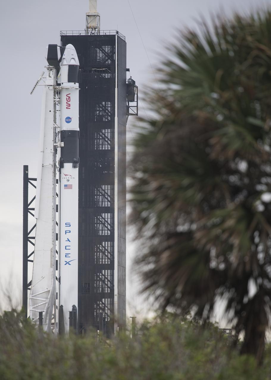 A SpaceX Falcon 9 rocket with the company's Crew Dragon spacecraft onboard is seen on the launch pad at Launch Complex 39A as preparations continue for the Crew-1 mission, Saturday, Nov. 14, 2020, at NASA’s Kennedy Space Center in Florida. NASA’s SpaceX Crew-1 mission is the first crew rotation mission of the SpaceX Crew Dragon spacecraft and Falcon 9 rocket to the International Space Station as part of the agency’s Commercial Crew Program. NASA astronauts Mike Hopkins, Victor Glover, and Shannon Walker, and astronaut Soichi Noguchi of the Japan Aerospace Exploration Agency (JAXA) are scheduled to launch at 7:27 p.m. EST on Sunday, Nov. 15, from Launch Complex 39A at the Kennedy Space Center. Photo Credit: (NASA/Joel Kowsky)