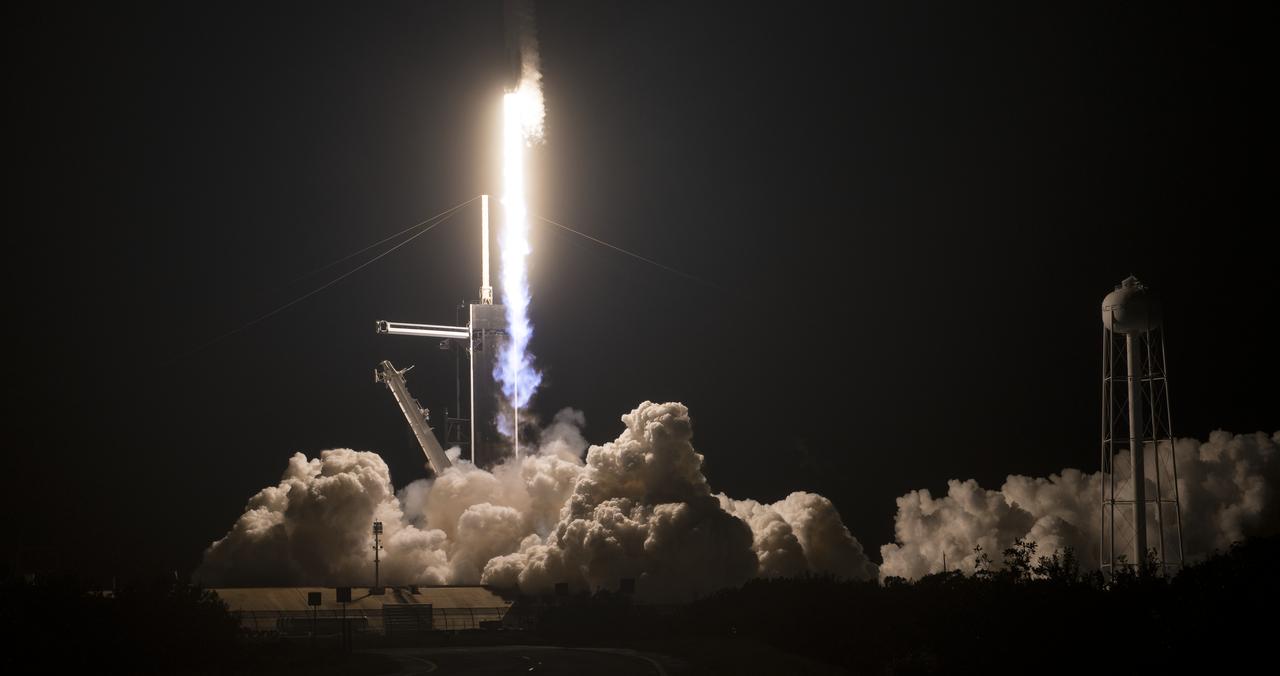 A SpaceX Falcon 9 rocket carrying the company's Crew Dragon spacecraft is launched on NASA’s SpaceX Crew-1 mission to the International Space Station with NASA astronauts Mike Hopkins, Victor Glover, Shannon Walker, and Japan Aerospace Exploration Agency astronaut Soichi Noguchi onboard, Sunday, Nov. 15, 2020, at NASA’s Kennedy Space Center in Florida. NASA’s SpaceX Crew-1 mission is the first crew rotation mission of the SpaceX Crew Dragon spacecraft and Falcon 9 rocket to the International Space Station as part of the agency’s Commercial Crew Program. Hopkins, Glover, Walker, and Noguchi launched at 7:27 p.m. EST from Launch Complex 39A at the Kennedy Space Center to begin a six month mission onboard the orbital outpost. Photo Credit: (NASA/Aubrey Gemignani)