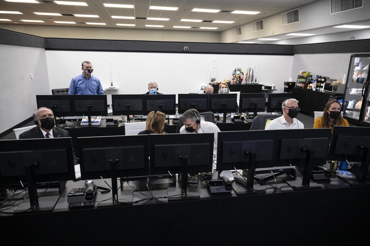 NASA and SpaceX managers are seen as they monitor the countdown of the launch of a SpaceX Falcon 9 rocket carrying the company's Crew Dragon spacecraft on NASA’s SpaceX Crew-1 mission with NASA astronauts Mike Hopkins, Victor Glover, Shannon Walker, and Japan Aerospace Exploration Agency (JAXA) astronaut Soichi Noguchi onboard, Sunday, Nov. 15, 2020, in firing room four of the Launch Control Center at NASA’s Kennedy Space Center in Florida. NASA’s SpaceX Crew-1 mission is the first crew rotation mission of the SpaceX Crew Dragon spacecraft and Falcon 9 rocket to the International Space Station as part of the agency’s Commercial Crew Program. Hopkins, Glover, Walker, and Noguchi are scheduled to launch at 7:27 p.m. EST, from Launch Complex 39A at the Kennedy Space Center. Photo Credit: (NASA/Aubrey Gemignani)