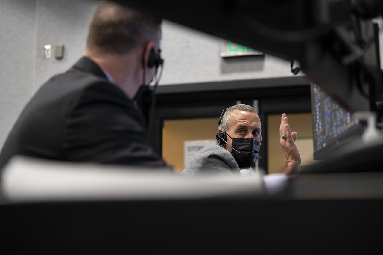 Lee Rosen, vice president, Mission and Launch Operations at SpaceX, speaks with Norm Knight, deputy director of Flight Operations at NASA's Johnson Space Center as they monitor the countdown of the launch of a SpaceX Falcon 9 rocket carrying the company's Crew Dragon spacecraft on NASA’s SpaceX Crew-1 mission with NASA astronauts Mike Hopkins, Victor Glover, Shannon Walker, and Japan Aerospace Exploration Agency (JAXA) astronaut Soichi Noguchi onboard, Sunday, Nov. 15, 2020, in firing room four of the Launch Control Center at NASA’s Kennedy Space Center in Florida. NASA’s SpaceX Crew-1 mission is the first crew rotation mission of the SpaceX Crew Dragon spacecraft and Falcon 9 rocket to the International Space Station as part of the agency’s Commercial Crew Program. Hopkins, Glover, Walker, and Noguchi are scheduled to launch at 7:27 p.m. EST, from Launch Complex 39A at the Kennedy Space Center. Photo Credit: (NASA/Aubrey Gemignani)