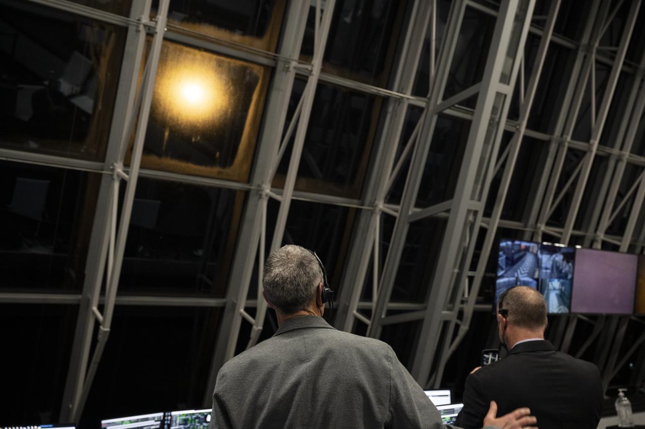 Lee Rosen, vice president, Mission and Launch Operations at SpaceX pats Norm Knight, deputy director of Flight Operations at NASA's Johnson Space Center on the back as they watch the launch of a SpaceX Falcon 9 rocket carrying the company's Crew Dragon spacecraft on NASA’s SpaceX Crew-1 mission with NASA astronauts Mike Hopkins, Victor Glover, Shannon Walker, and Japan Aerospace Exploration Agency (JAXA) astronaut Soichi Noguchi onboard, Sunday, Nov. 15, 2020, in firing room four of the Launch Control Center at NASA’s Kennedy Space Center in Florida. NASA’s SpaceX Crew-1 mission is the first crew rotation mission of the SpaceX Crew Dragon spacecraft and Falcon 9 rocket to the International Space Station as part of the agency’s Commercial Crew Program. Hopkins, Glover, Walker, and Noguchi launched at 7:27 p.m. EST, from Launch Complex 39A at the Kennedy Space Center. Photo Credit: (NASA/Aubrey Gemignani)