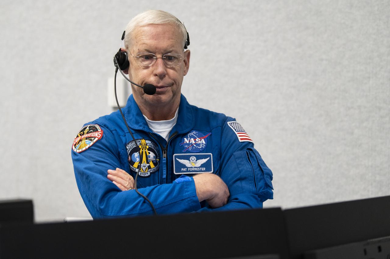 Pat Forrester, NASA’s chief of the astronaut office monitor the launch of a SpaceX Falcon 9 rocket carrying the company's Crew Dragon spacecraft on NASA’s SpaceX Crew-1 mission with NASA astronauts Mike Hopkins, Victor Glover, Shannon Walker, and Japan Aerospace Exploration Agency (JAXA) astronaut Soichi Noguchi onboard, Sunday, Nov. 15, 2020, in firing room four of the Launch Control Center at NASA’s Kennedy Space Center in Florida. NASA’s SpaceX Crew-1 mission is the first crew rotation mission of the SpaceX Crew Dragon spacecraft and Falcon 9 rocket to the International Space Station as part of the agency’s Commercial Crew Program. Hopkins, Glover, Walker, and Noguchi launched at 7:27 p.m. EST, from Launch Complex 39A at the Kennedy Space Center. Photo Credit: (NASA/Aubrey Gemignani)