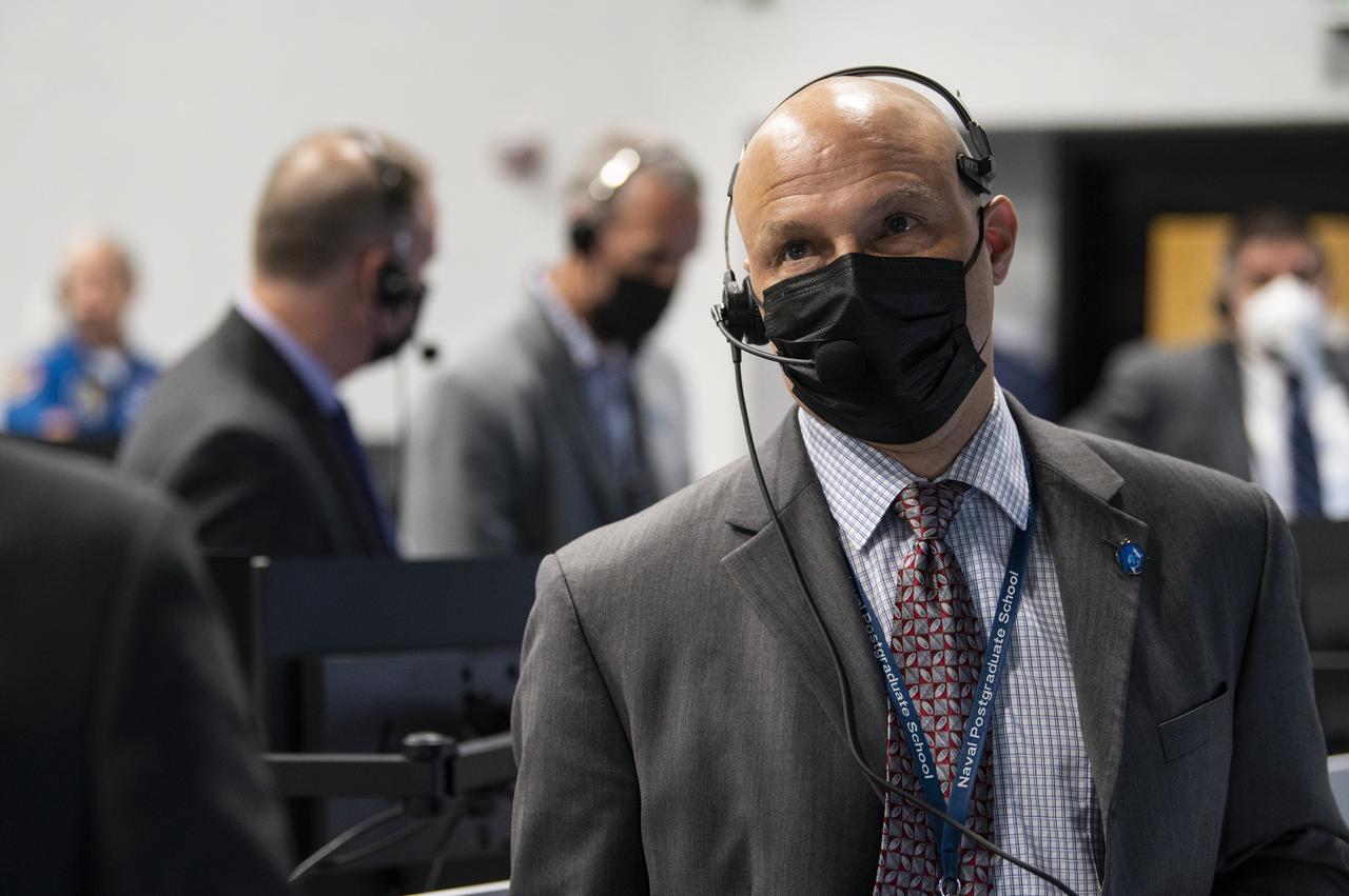 Michael Hess, acting associate director of NASA’s Johnson Space Center monitors the launch of a SpaceX Falcon 9 rocket carrying the company's Crew Dragon spacecraft on NASA’s SpaceX Crew-1 mission with NASA astronauts Mike Hopkins, Victor Glover, Shannon Walker, and Japan Aerospace Exploration Agency (JAXA) astronaut Soichi Noguchi onboard, Sunday, Nov. 15, 2020, in firing room four of the Launch Control Center at NASA’s Kennedy Space Center in Florida. NASA’s SpaceX Crew-1 mission is the first crew rotation mission of the SpaceX Crew Dragon spacecraft and Falcon 9 rocket to the International Space Station as part of the agency’s Commercial Crew Program. Hopkins, Glover, Walker, and Noguchi launched at 7:27 p.m. EST, from Launch Complex 39A at the Kennedy Space Center. Photo Credit: (NASA/Aubrey Gemignani)