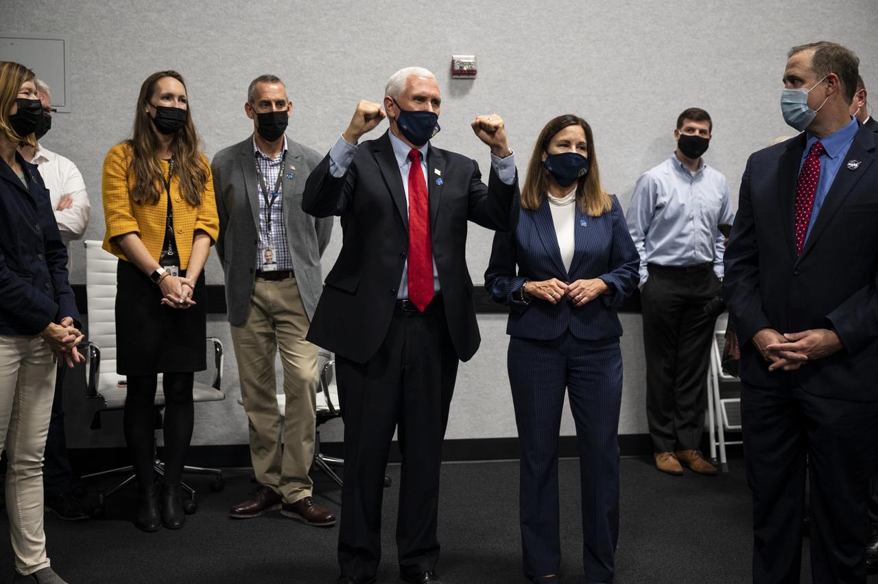 Vice President Mike Pence congratulates the NASA and SpaceX teams for a successful launch of the SpaceX Falcon 9 rocket carrying the company's Crew Dragon spacecraft on NASA’s SpaceX Crew-1 mission with NASA astronauts Mike Hopkins, Victor Glover, Shannon Walker, and Japan Aerospace Exploration Agency (JAXA) astronaut Soichi Noguchi onboard, Sunday, Nov. 15, 2020, in firing room four of the Launch Control Center at NASA’s Kennedy Space Center in Florida. NASA’s SpaceX Crew-1 mission is the first crew rotation mission of the SpaceX Crew Dragon spacecraft and Falcon 9 rocket to the International Space Station as part of the agency’s Commercial Crew Program. Hopkins, Glover, Walker, and Noguchi launched at 7:27 p.m. EST, from Launch Complex 39A at the Kennedy Space Center. Photo Credit: (NASA/Aubrey Gemignani)