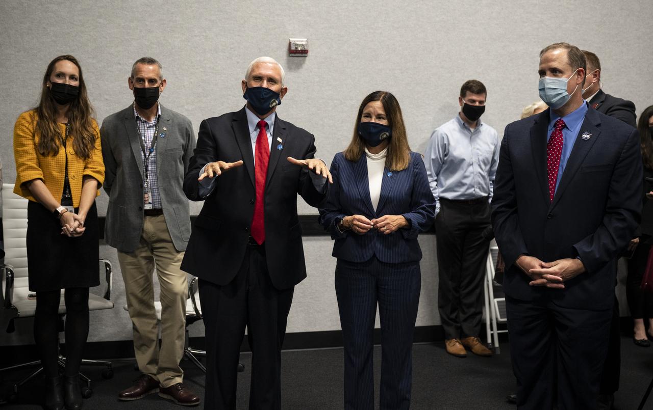 Vice President Mike Pence congratulates the NASA and SpaceX teams for a successful launch of the SpaceX Falcon 9 rocket carrying the company's Crew Dragon spacecraft on NASA’s SpaceX Crew-1 mission with NASA astronauts Mike Hopkins, Victor Glover, Shannon Walker, and Japan Aerospace Exploration Agency (JAXA) astronaut Soichi Noguchi onboard, Sunday, Nov. 15, 2020, in firing room four of the Launch Control Center at NASA’s Kennedy Space Center in Florida. NASA’s SpaceX Crew-1 mission is the first crew rotation mission of the SpaceX Crew Dragon spacecraft and Falcon 9 rocket to the International Space Station as part of the agency’s Commercial Crew Program. Hopkins, Glover, Walker, and Noguchi launched at 7:27 p.m. EST, from Launch Complex 39A at the Kennedy Space Center. Photo Credit: (NASA/Aubrey Gemignani)