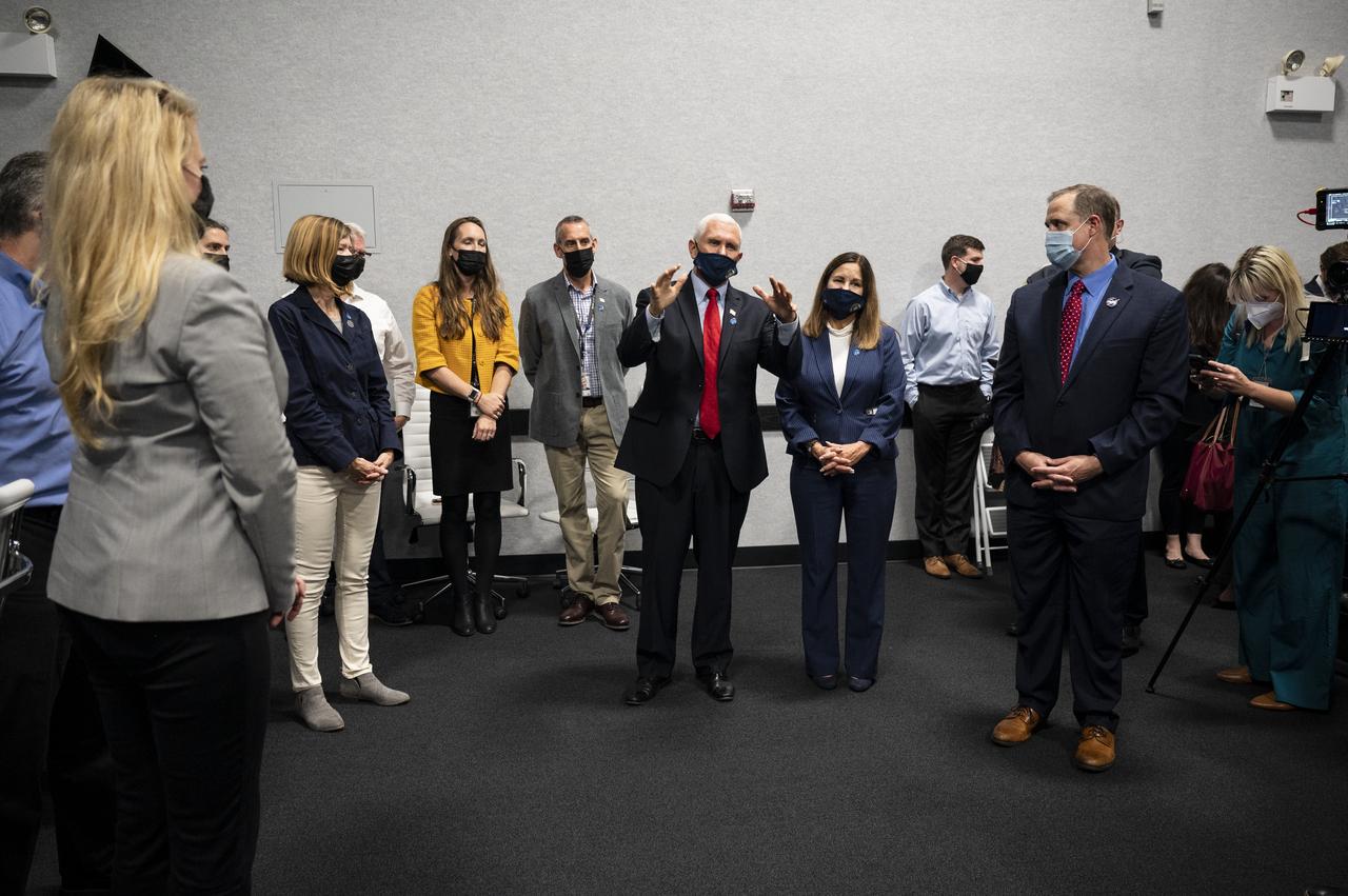 Vice President Mike Pence congratulates the NASA and SpaceX teams for a successful launch of the SpaceX Falcon 9 rocket carrying the company's Crew Dragon spacecraft on NASA’s SpaceX Crew-1 mission with NASA astronauts Mike Hopkins, Victor Glover, Shannon Walker, and Japan Aerospace Exploration Agency (JAXA) astronaut Soichi Noguchi onboard, Sunday, Nov. 15, 2020, in firing room four of the Launch Control Center at NASA’s Kennedy Space Center in Florida. NASA’s SpaceX Crew-1 mission is the first crew rotation mission of the SpaceX Crew Dragon spacecraft and Falcon 9 rocket to the International Space Station as part of the agency’s Commercial Crew Program. Hopkins, Glover, Walker, and Noguchi launched at 7:27 p.m. EST, from Launch Complex 39A at the Kennedy Space Center. Photo Credit: (NASA/Aubrey Gemignani)
