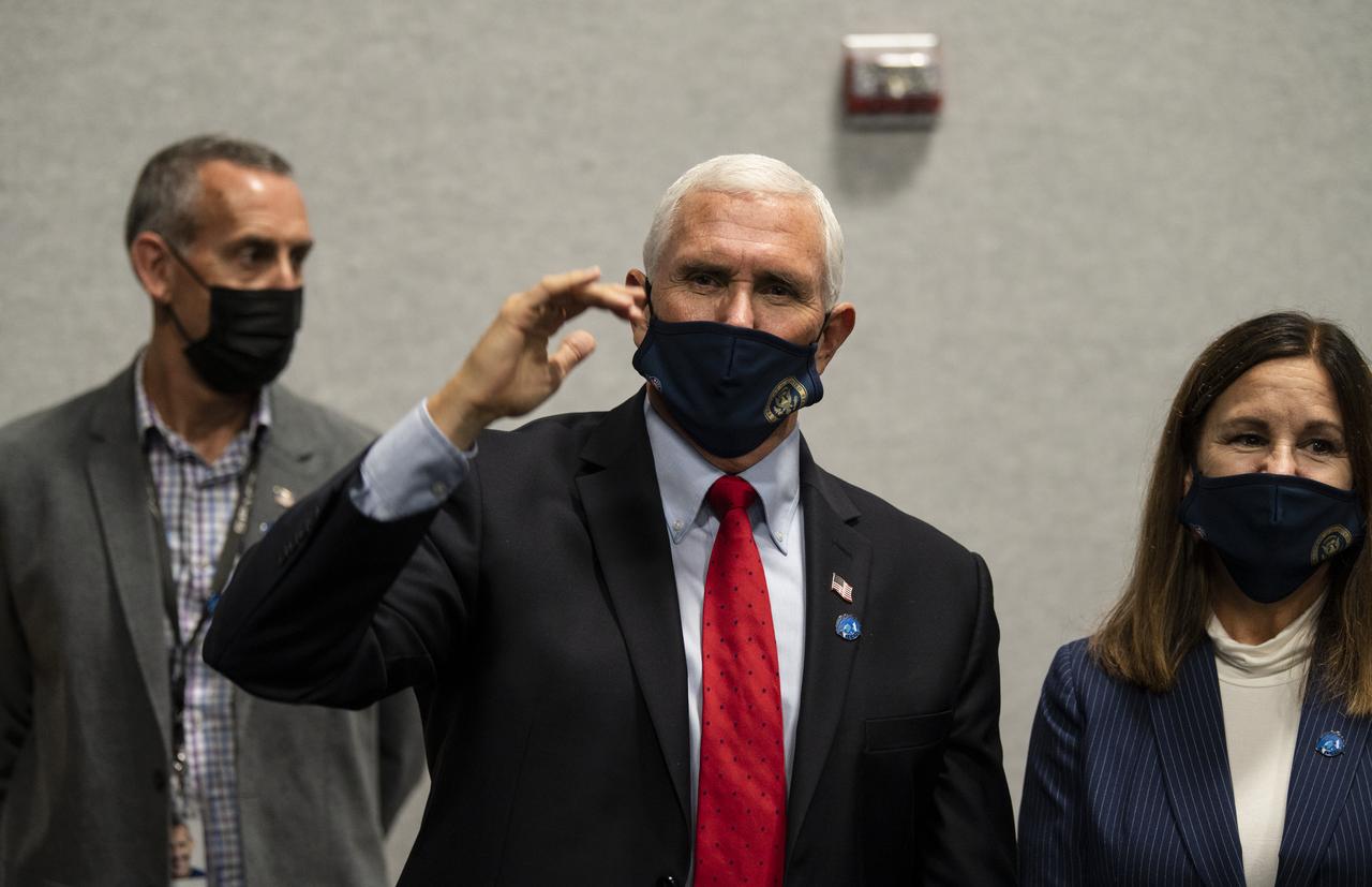 Vice President Mike Pence congratulates the NASA and SpaceX teams after the launch of a SpaceX Falcon 9 rocket carrying the company's Crew Dragon spacecraft on NASA’s SpaceX Crew-1 mission with NASA astronauts Mike Hopkins, Victor Glover, Shannon Walker, and Japan Aerospace Exploration Agency (JAXA) astronaut Soichi Noguchi onboard, Sunday, Nov. 15, 2020, in firing room four of the Launch Control Center at NASA’s Kennedy Space Center in Florida. NASA’s SpaceX Crew-1 mission is the first crew rotation mission of the SpaceX Crew Dragon spacecraft and Falcon 9 rocket to the International Space Station as part of the agency’s Commercial Crew Program. Hopkins, Glover, Walker, and Noguchi launched at 7:27 p.m. EST, from Launch Complex 39A at the Kennedy Space Center. Photo Credit: (NASA/Aubrey Gemignani)