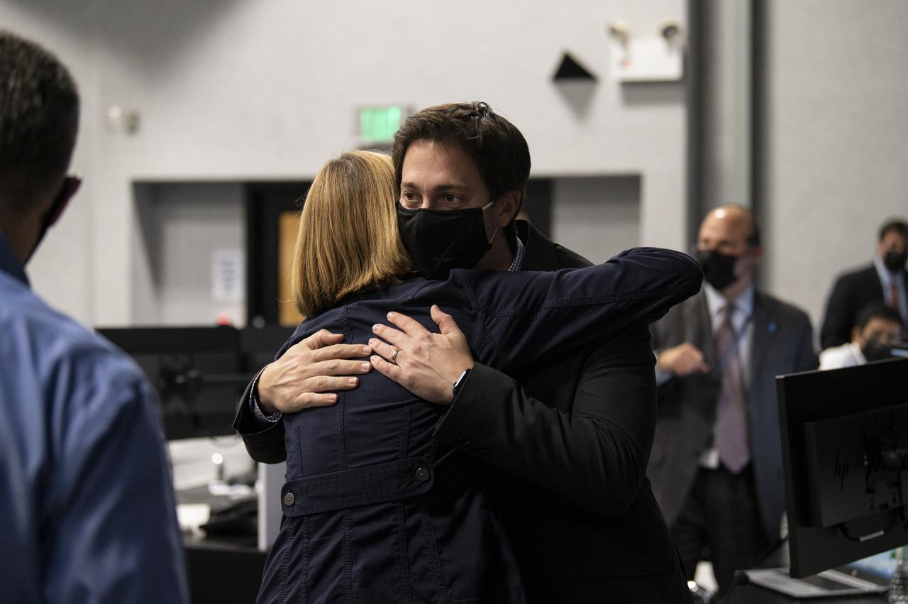 Kathy Lueders, Associate Administrator of the Human Exploration and Operations Mission Directorate, hugs members of the SpaceX team after the launch of a SpaceX Falcon 9 rocket carrying the company's Crew Dragon spacecraft on NASA’s SpaceX Crew-1 mission with NASA astronauts Mike Hopkins, Victor Glover, Shannon Walker, and Japan Aerospace Exploration Agency (JAXA) astronaut Soichi Noguchi onboard, Sunday, Nov. 15, 2020, in firing room four of the Launch Control Center at NASA’s Kennedy Space Center in Florida. NASA’s SpaceX Crew-1 mission is the first crew rotation mission of the SpaceX Crew Dragon spacecraft and Falcon 9 rocket to the International Space Station as part of the agency’s Commercial Crew Program. Hopkins, Glover, Walker, and Noguchi launched at 7:27 p.m. EST, from Launch Complex 39A at the Kennedy Space Center. Photo Credit: (NASA/Aubrey Gemignani)