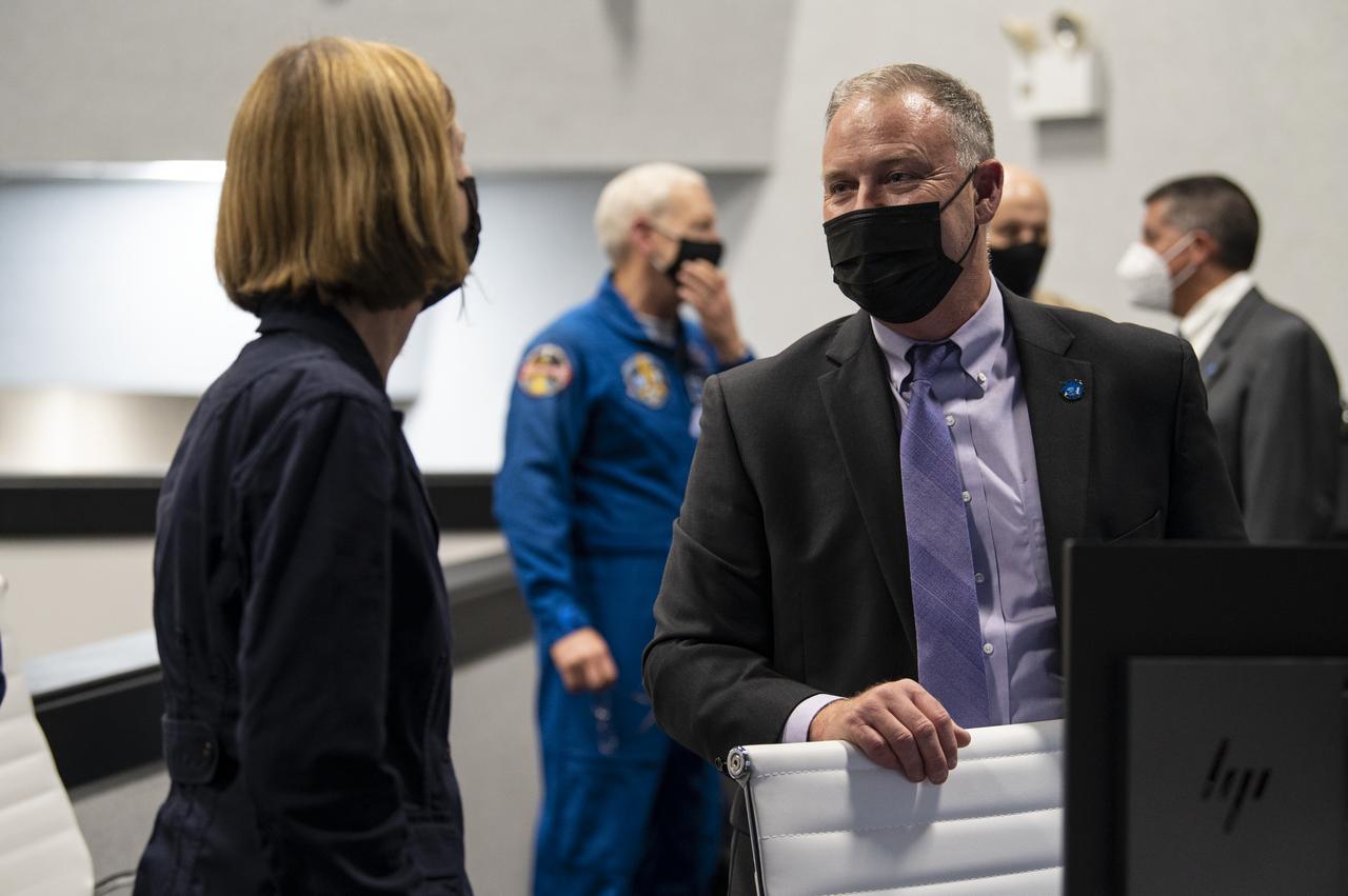 Kathy Lueders, Associate Administrator of the Human Exploration and Operations Mission Directorate, left, congratulates Norm Knight, deputy director of Flight Operations at NASA's Johnson Space Center after the launch of a SpaceX Falcon 9 rocket carrying the company's Crew Dragon spacecraft on NASA’s SpaceX Crew-1 mission with NASA astronauts Mike Hopkins, Victor Glover, Shannon Walker, and Japan Aerospace Exploration Agency (JAXA) astronaut Soichi Noguchi onboard, Sunday, Nov. 15, 2020, in firing room four of the Launch Control Center at NASA’s Kennedy Space Center in Florida. NASA’s SpaceX Crew-1 mission is the first crew rotation mission of the SpaceX Crew Dragon spacecraft and Falcon 9 rocket to the International Space Station as part of the agency’s Commercial Crew Program. Hopkins, Glover, Walker, and Noguchi launched at 7:27 p.m. EST, from Launch Complex 39A at the Kennedy Space Center. Photo Credit: (NASA/Aubrey Gemignani)