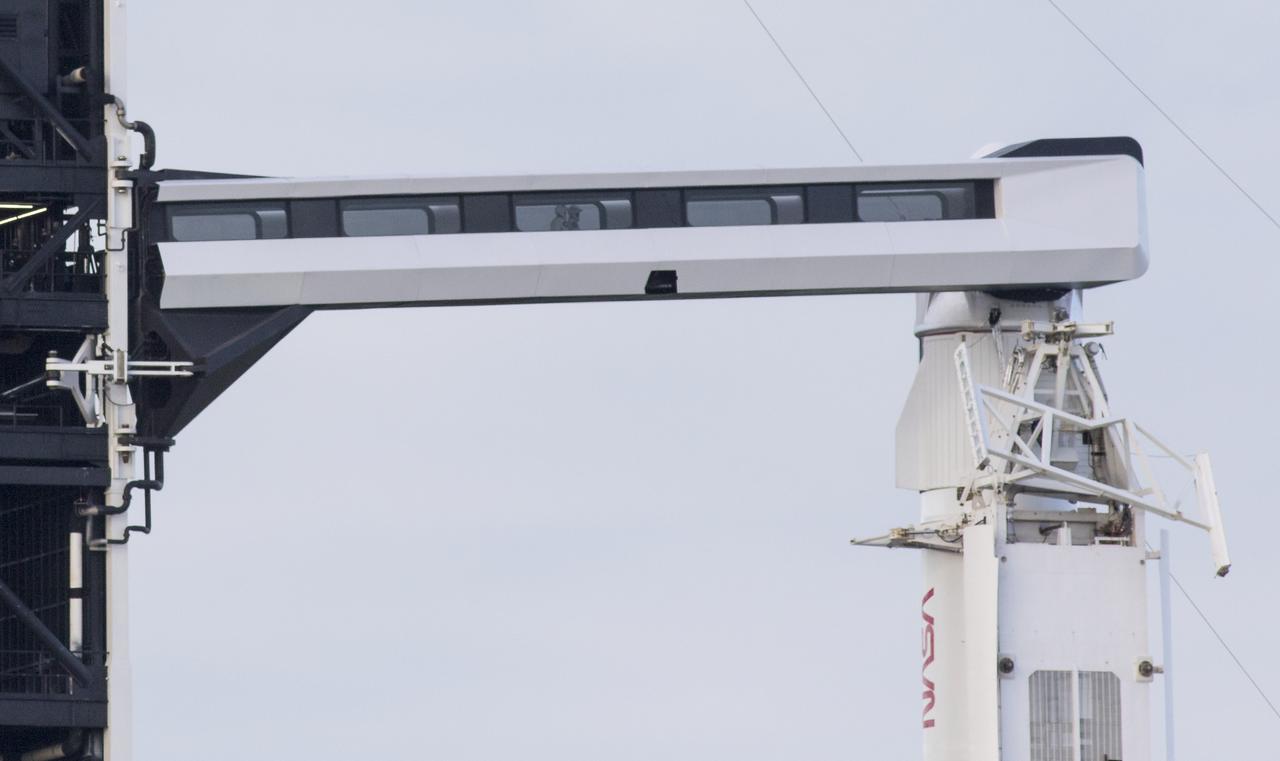 NASA astronaut Victor Glover and Japan Aerospace Exploration Agency (JAXA) astronaut Soichi Noguchi are seen on the crew access arm of Launch Complex 39A before boarding SpaceX’s Crew Dragon spacecraft atop the company’s Falcon 9 rocket before the launch of NASA’s SpaceX Crew-1 mission, Sunday, Nov. 15, 2020, at NASA’s Kennedy Space Center in Florida. NASA’s SpaceX Crew-1 mission is the first crew rotation mission of the SpaceX Crew Dragon spacecraft and Falcon 9 rocket to the International Space Station as part of the agency’s Commercial Crew Program. Glover, Noguchi, and NASA astronauts Shannon Walker and Mike Hopkins launched at 7:27 p.m. EST from Launch Complex 39A at the Kennedy Space Center to begin a six month mission onboard the orbital outpost. Photo Credit: (NASA/Joel Kowsky)