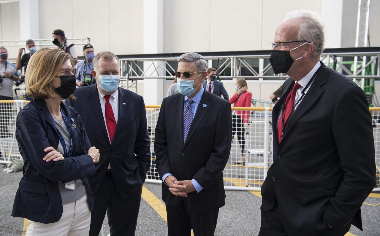 Kathy Lueders, associate administrator for NASA's Human Exploration and Operations Mission Directorate, left, NASA Deputy Administrator Jim Morhard, second from left, Kennedy Space Center Director Bob Cabana, second from right, and Sen. Jerry Moran (R-KS), right, are seen as they wait to see NASA astronauts Mike Hopkins, Victor Glover, Shannon Walker, and Japan Aerospace Exploration Agency (JAXA) astronaut Soichi Noguchi, depart the Neil A. Armstrong Operations and Checkout Building for Launch Complex 39A to board the SpaceX Crew Dragon spacecraft for the Crew-1 mission launch Sunday, Nov. 15, 2020, at NASA’s Kennedy Space Center in Florida. NASA’s SpaceX Crew-1 mission is the first crew rotation mission of the SpaceX Crew Dragon spacecraft and Falcon 9 rocket to the International Space Station as part of the agency’s Commercial Crew Program. Hopkins, Glover, Walker, and Noguchi launched at 7:27 p.m. EST on Sunday, Nov. 15, from Launch Complex 39A at the Kennedy Space Center. Photo Credit: (NASA/Joel Kowsky)