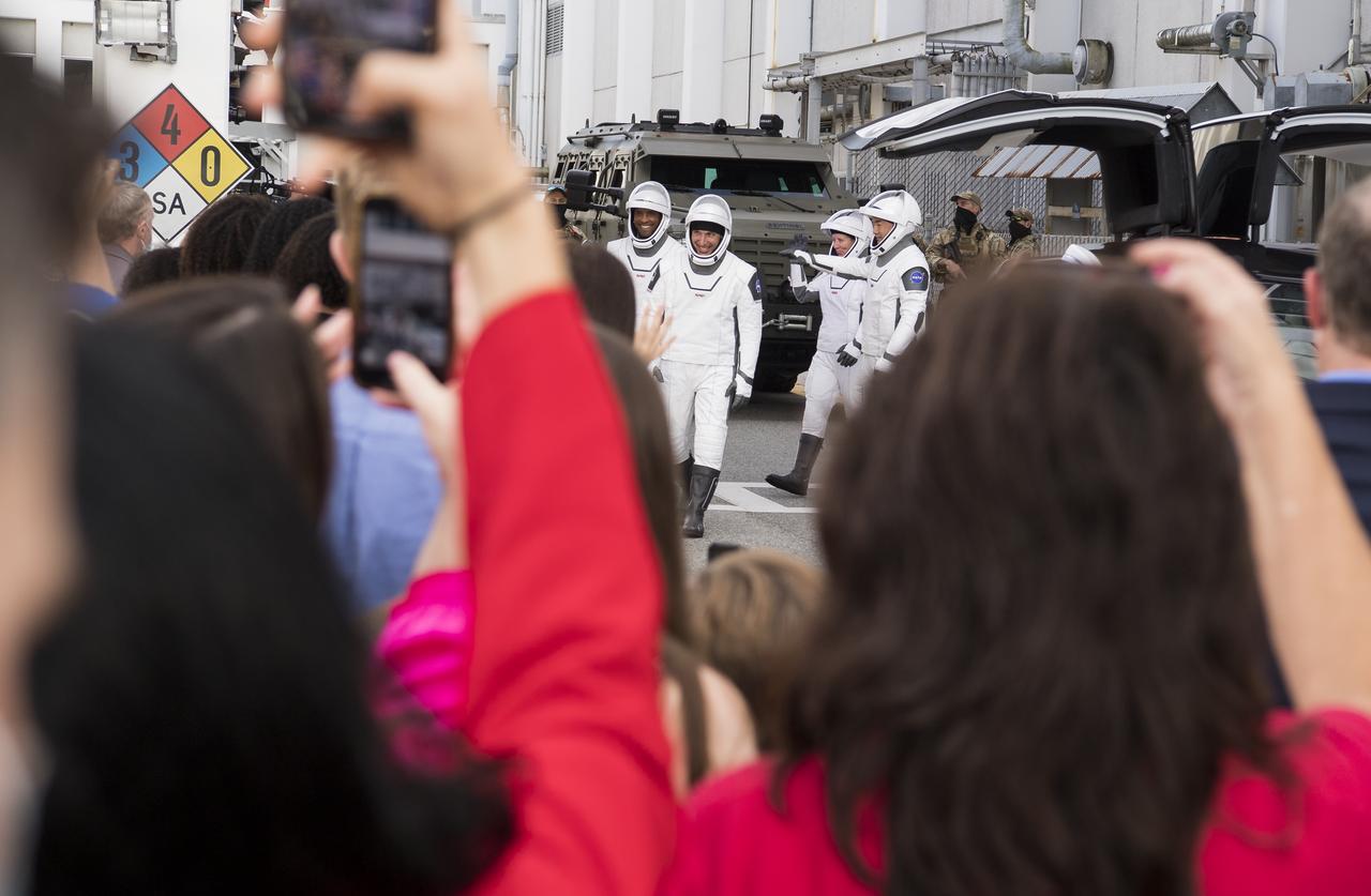 NASA astronauts Mike Hopkins, Victor Glover, Shannon Walker, and Japan Aerospace Exploration Agency (JAXA) astronaut Soichi Noguchi, wearing SpaceX spacesuits, are seen as they prepare to depart the Neil  A. Armstrong Operations and Checkout Building for Launch Complex 39A to board the SpaceX Crew Dragon spacecraft for the Crew-1 mission launch, Sunday, Nov. 15, 2020, at NASA’s Kennedy Space Center in Florida. NASA’s SpaceX Crew-1 mission is the first crew rotation mission of the SpaceX Crew Dragon spacecraft and Falcon 9 rocket to the International Space Station as part of the agency’s Commercial Crew Program. Hopkins, Glover, Walker, and Noguchi launched at 7:27 p.m. EST on Sunday, Nov. 15, from Launch Complex 39A at the Kennedy Space Center.  Photo Credit: (NASA/Joel Kowsky)