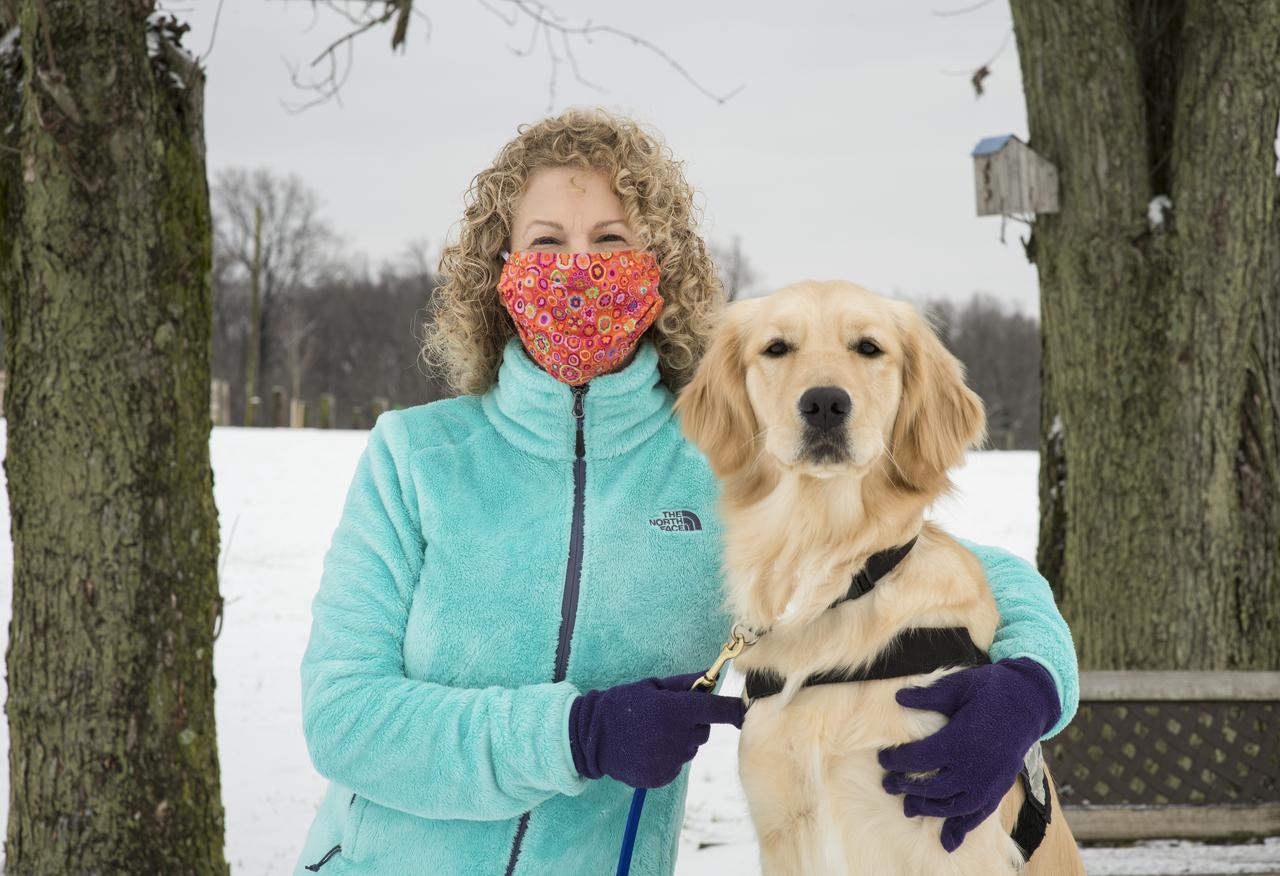 “It was part of my career, but then it was also personal. I was doing it on a volunteer basis, but it was part of my work because I was bringing my service dog in training everywhere with me, which meant to work every day and to meetings at NOAA (National Oceanic and Atmospheric Administration). And I was taking the dog across the country to meetings over at Ball Aerospace; that was all part of the training of a service dog. That was an incredible time. I really enjoyed it. “The fact that I was able to do the two combined, that to me was just such an accomplishment. To some people, it could be they got permission to do it and then that’s all they focused on was the dog, but no. I had my job I had to do. I’ve always gotten a distinguished rating in my performances my entire career, and it didn't change when I was training this service dog. “It was a challenge for sure. “After I had to turn back over the service dog I trained, it was really very difficult because the dog was with me for two years, even though I knew it was for a wonderful cause. I ended up going out and getting my own dog who I’ve trained to be a therapy dog, so now we do therapy visits with veterans, elderly, and others. ” Jean Wolfe, Program Executive for the Geostationary Operational Environmental Satellite (GOES)-R Series Program at NASA Headquarters, poses for a portrait with Bonnie, who was named for U.S. Air Force Reserve Major Bonnie Carroll, Ret., Friday, Dec. 18, 2020 at the Warrior Canine Connection in Boyds, MD. “Warrior Canine Connection enlists service members and veterans with combat stress in the critical mission of training service dogs for fellow Wounded Warriors.” Photo Credit: (NASA/Aubrey Gemignani)