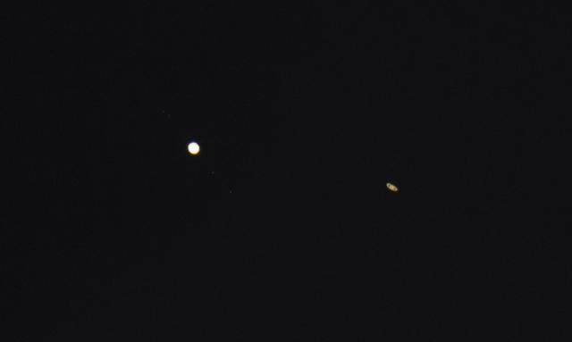 Jupiter, left, and Saturn, right, are seen after sunset from Alexandria, Va., Tuesday, Dec. 22, 2020. The two planets are now slowly separating from each other in the sky, after appearing a tenth of a degree apart during the "great conjunction" on December 21. Photo Credit: (NASA/Joel Kowsky)