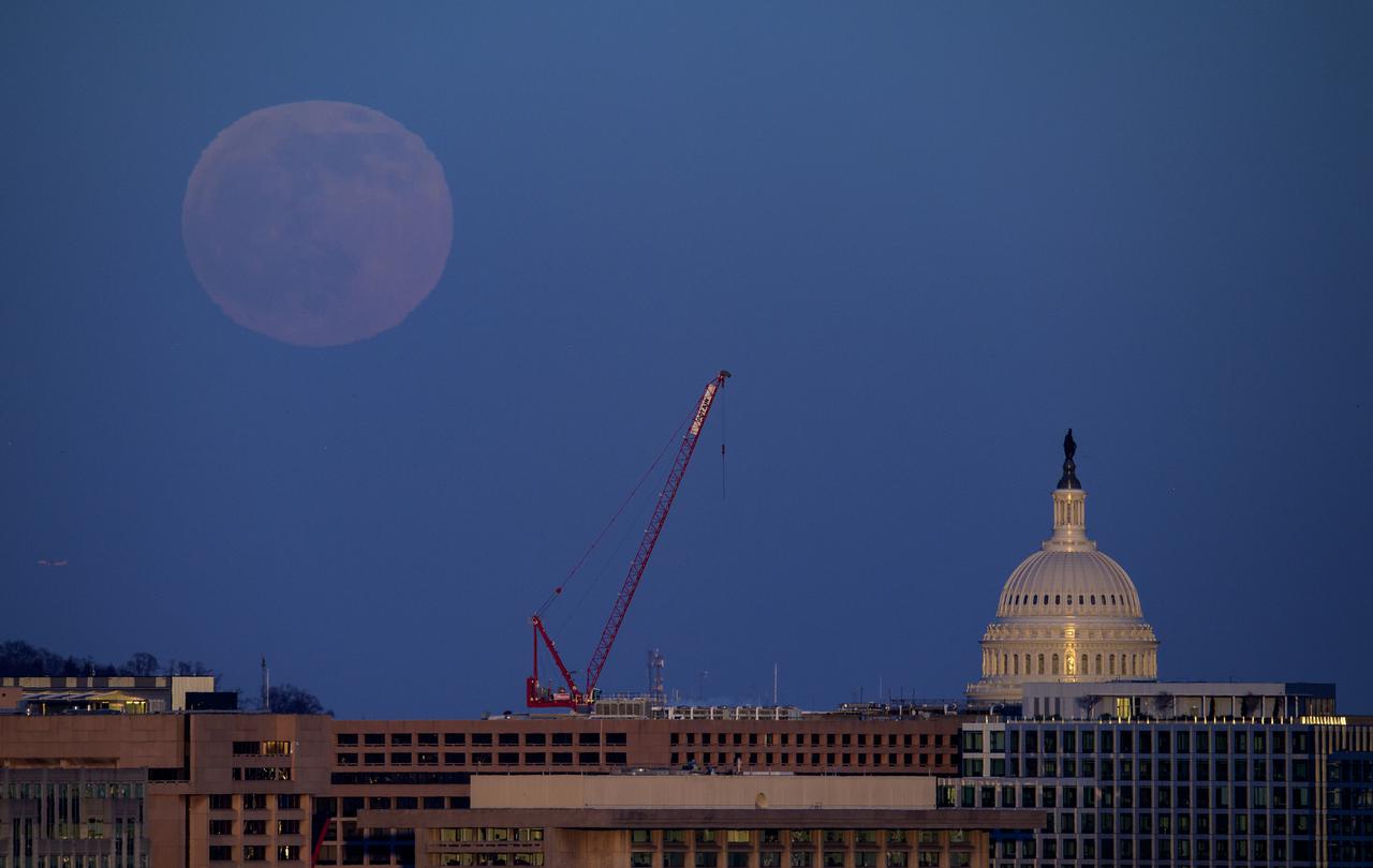 The rising full moon is seen with the U.S. Capitol, Tuesday, Dec. 29, 2020, in Washington. Photo Credit: (NASA/Bill Ingalls)