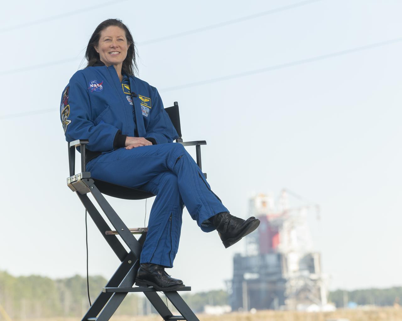 NASA astronaut Tracy Caldwell Dyson discusses the upcoming Green Run hot fire test on NASA television, Saturday, January 16, 2021, at NASA's Stennis Space Center near Bay St. Louis, Mississippi. In the background, the core stage for the first flight of NASA’s Space Launch System rocket is seen in the B-2 Test Stand ahead of a scheduled eight minute duration hot fire test. The hot fire test is the final stage of the Green Run test series, a comprehensive assessment of the Space Launch System’s core stage prior to launching the Artemis I mission to the Moon.  Photo Credit: (NASA/Robert Markowitz)