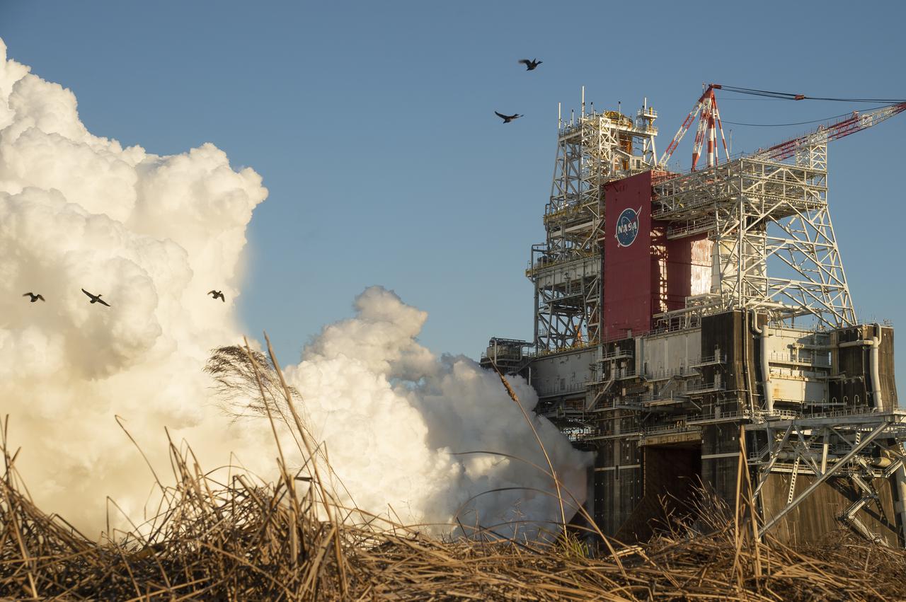 The core stage for the first flight of NASA’s Space Launch System rocket is seen in the B-2 Test Stand during a scheduled eight minute duration hot fire test, Saturday, Jan. 16, 2021, at NASA’s Stennis Space Center near Bay St. Louis, Mississippi. The four RS-25 engines fired for a little more than one minute and generated 1.6 million pounds of thrust. The hot fire is the final test of the Green Run test series, a comprehensive assessment of the Space Launch System’s core stage prior to launching the Artemis I mission to the Moon.  Photo Credit: (NASA/Robert Markowitz)
