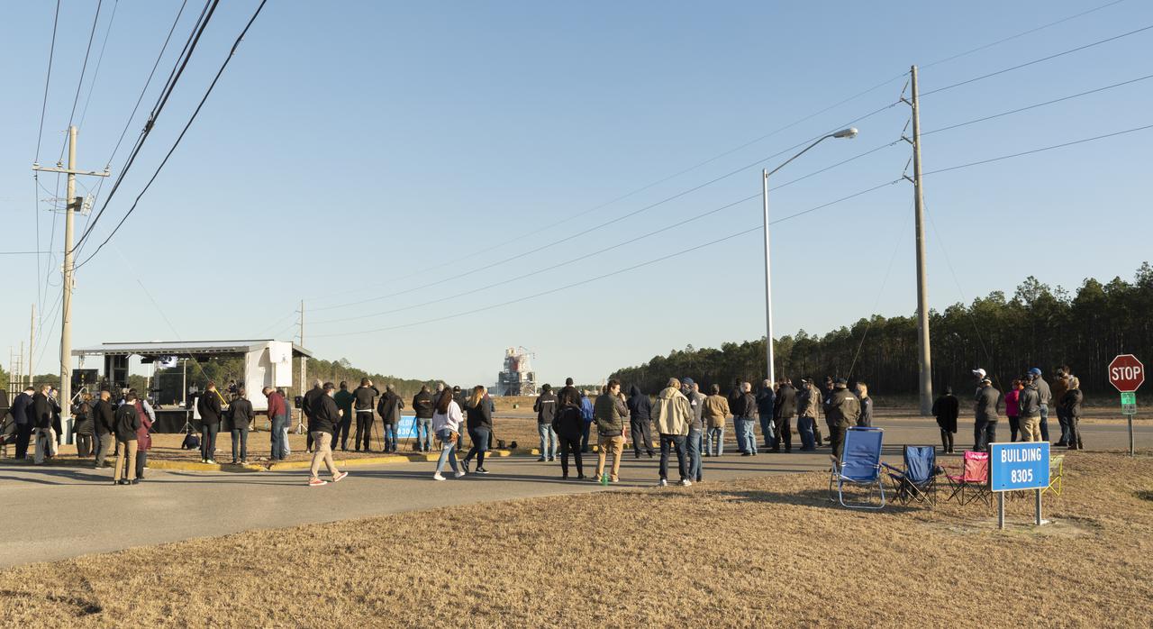 NASA guests gather to watch as the core stage for the first flight of NASA's Space Launch System rocket undergoes a scheduled eight minute duration hot fire test in the B-2 Test Stand, January 16, 2021, at NASA's Stennis Space Center near Bay St. Louis, Mississippi. The four RS-25 engines fired for a little more than one minute and generated 1.6 million pounds of thrust. The hot fire is the final test of the Green Run test series, a comprehensive assessment of the Space Launch System’s core stage prior to launching the Artemis I mission to the Moon.  Photo Credit: (NASA/Robert Markowitz)