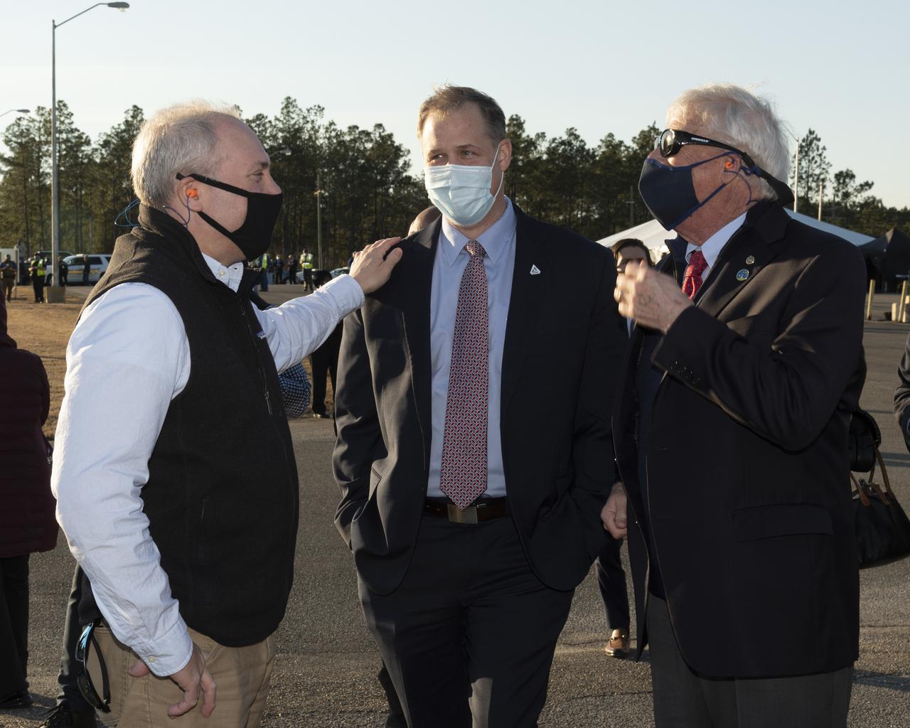 U.S. Representative Steve Scalise, left, NASA Administrator Jim Bridenstine and U.S. Senator Roger Wicker, right gather to watch as the core stage for the first flight of NASA's Space Launch System rocket undergoes a scheduled eight minute duration hot fire test in the B-2 Test Stand, January 16, 2021, at NASA's Stennis Space Center near Bay St. Louis, Mississippi. The four RS-25 engines fired for a little more than one minute and generated 1.6 million pounds of thrust. The hot fire is the final test of the Green Run test series, a comprehensive assessment of the Space Launch System’s core stage prior to launching the Artemis I mission to the Moon.  Photo Credit: (NASA/Robert Markowitz)