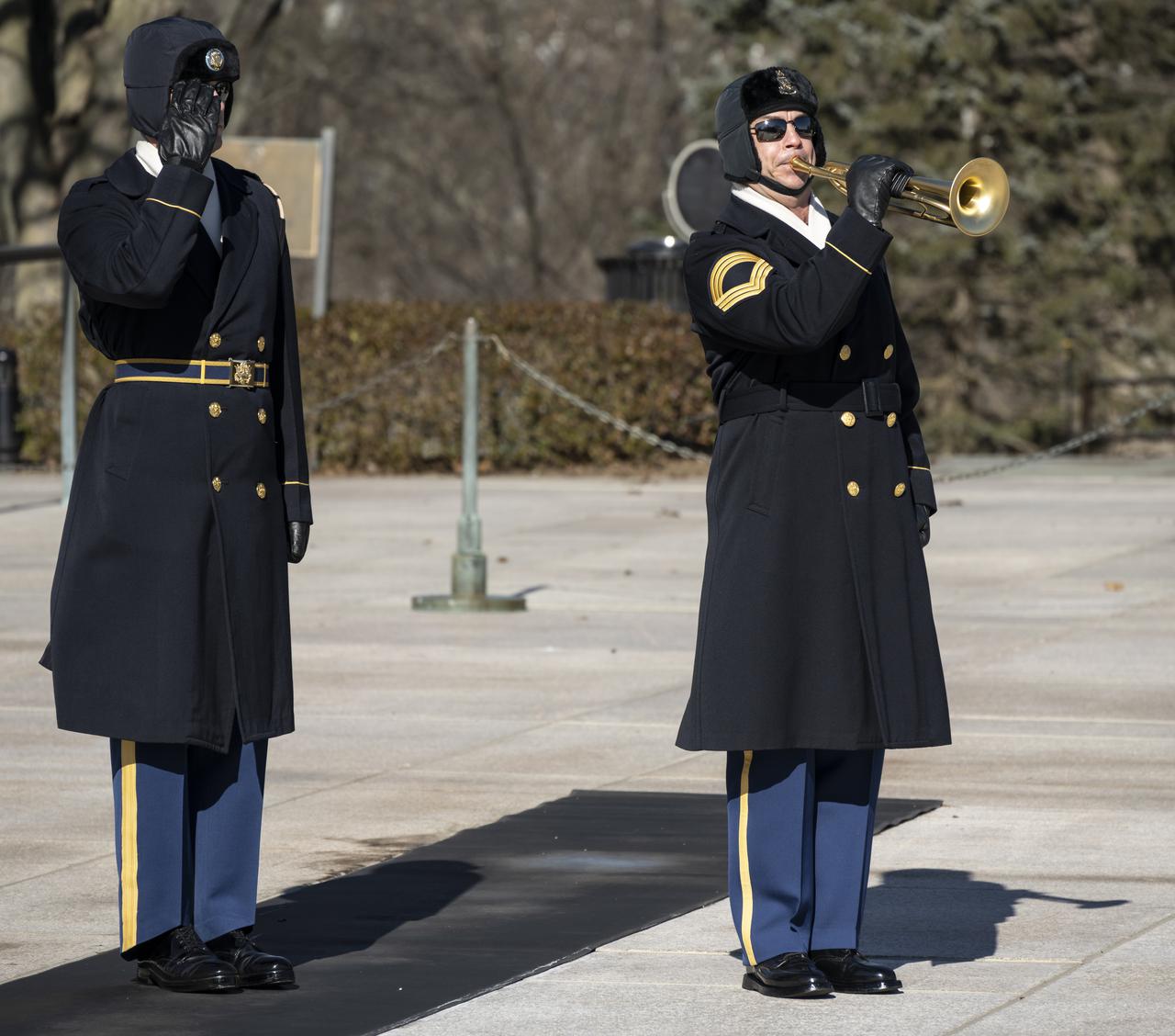 Taps is played by a member of The Old Guard after a wreath was laid at the Tomb of the Unknowns by acting NASA Administrator Steve Jurczyk as part of NASA's Day of Remembrance, Thursday, Jan. 28, 2021, at Arlington National Cemetery in Arlington, Va.  The wreaths were laid in memory of those men and women who lost their lives in the quest for space exploration.  Photo Credit: (NASA/Bill Ingalls)