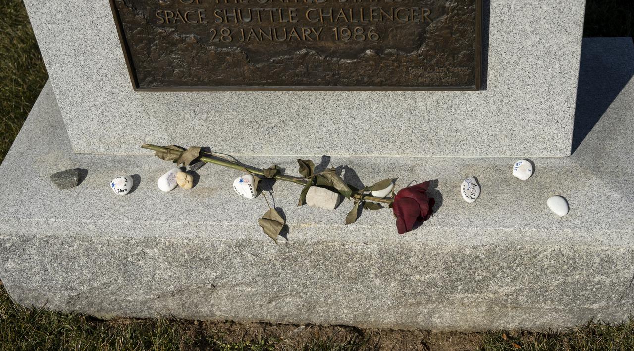Remembrances are seen at the base of the Space Shuttle Challenger Crew Memorial during NASA's Day of Remembrance, Thursday, Jan. 28, 2021, at Arlington National Cemetery in Arlington, Va. Wreaths were also laid in memory of those men and women who lost their lives in the quest for space exploration. Photo Credit: (NASA/Bill Ingalls)