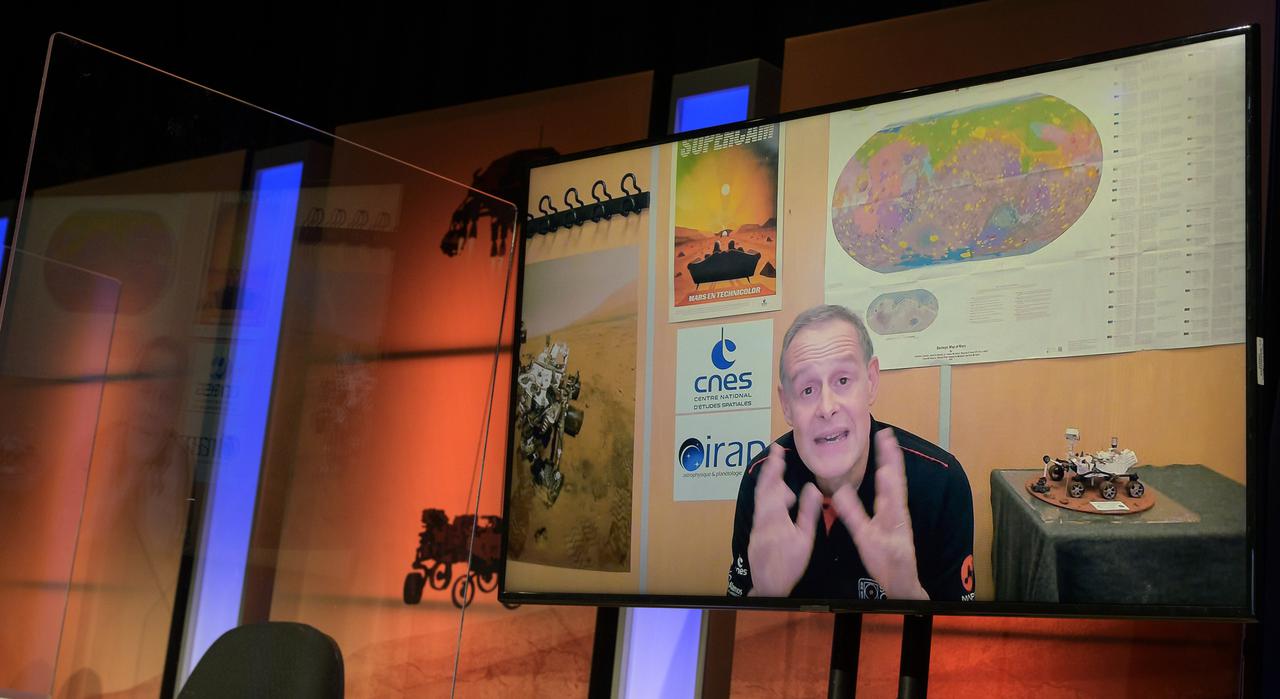 Deputy principal investigator, SuperCam instrument, Institut de Recherche Astrophysique et Planétologie, Toulouse, France, Sylvestre Maurice, gives remarks via remote during a NASA Perseverance rover mission science overview, Tuesday, Feb. 16, 2021, at NASA's Jet Propulsion Laboratory in Pasadena, California. The Perseverance Mars rover is due to land on Mars Thursday, Feb. 18, 2021. A key objective for Perseverance’s mission on Mars is astrobiology, including the search for signs of ancient microbial life. The rover will characterize the planet’s geology and past climate, pave the way for human exploration of the Red Planet, and be the first mission to collect and cache Martian rock and regolith. Photo Credit: (NASA/Bill Ingalls)