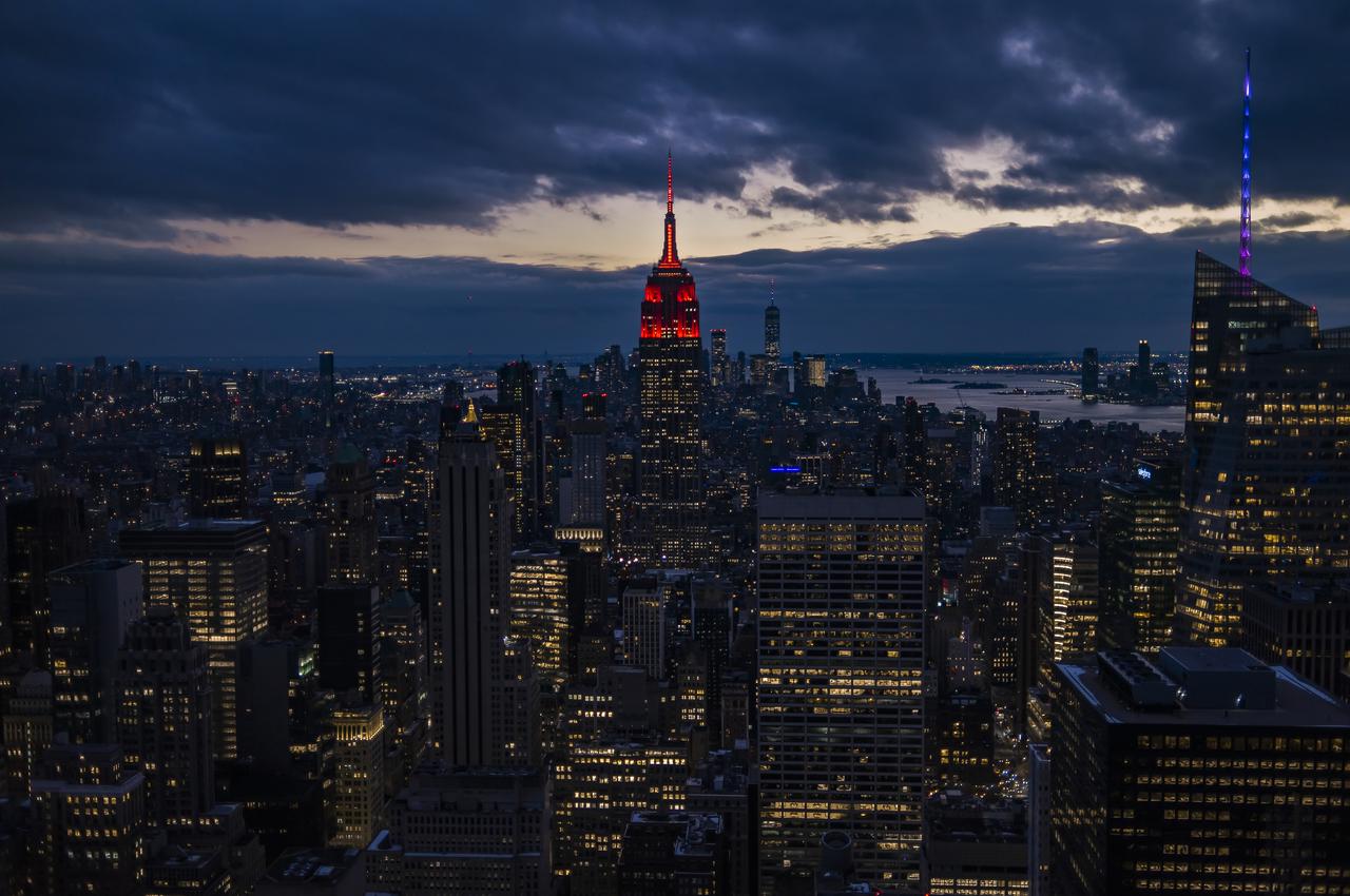 The Empire State Building is illuminated in red to celebrate this Thursday's scheduled landing on Mars of NASA's Perseverance rover, Tuesday, Feb. 16, 2021 in New York City. A key objective for Perseverance’s mission on Mars is astrobiology, including the search for signs of ancient microbial life. The rover will characterize the planet’s geology and past climate, pave the way for human exploration of the Red Planet, and be the first mission to collect and cache Martian rock and regolith. Photo Credit: (NASA/Emma Howells)