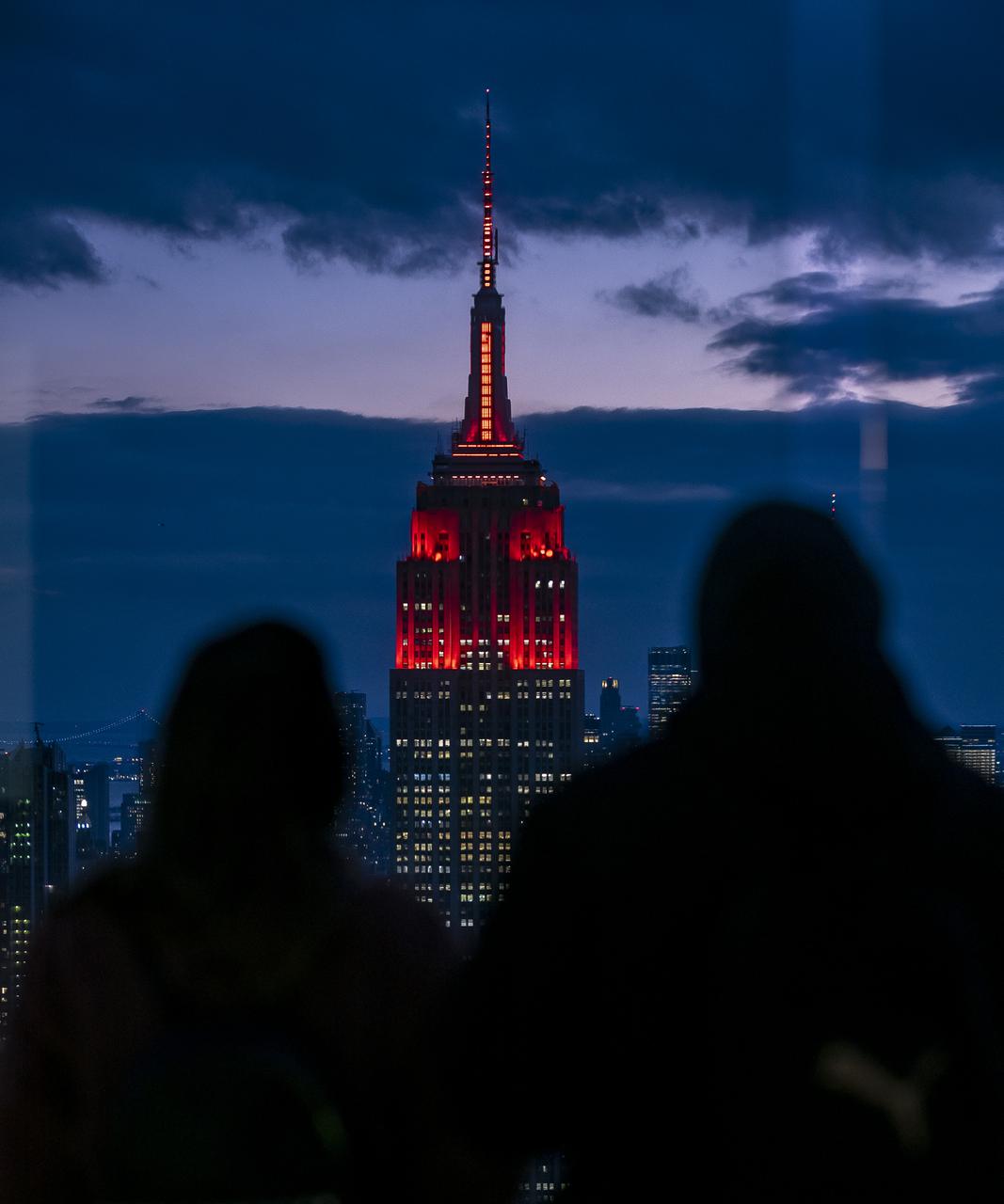 The Empire State Building is illuminated in red to celebrate this Thursday's scheduled landing on Mars of NASA's Perseverance rover, Tuesday, Feb. 16, 2021 in New York City. A key objective for Perseverance’s mission on Mars is astrobiology, including the search for signs of ancient microbial life. The rover will characterize the planet’s geology and past climate, pave the way for human exploration of the Red Planet, and be the first mission to collect and cache Martian rock and regolith. Photo Credit: (NASA/Emma Howells)