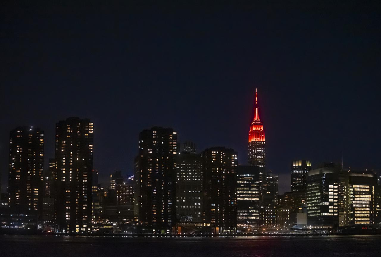 The Empire State Building is illuminated in red to celebrate this Thursday's scheduled landing on Mars of NASA's Perseverance rover, Tuesday, Feb. 16, 2021 in New York City. A key objective for Perseverance’s mission on Mars is astrobiology, including the search for signs of ancient microbial life. The rover will characterize the planet’s geology and past climate, pave the way for human exploration of the Red Planet, and be the first mission to collect and cache Martian rock and regolith. Photo Credit: (NASA/Emma Howells)