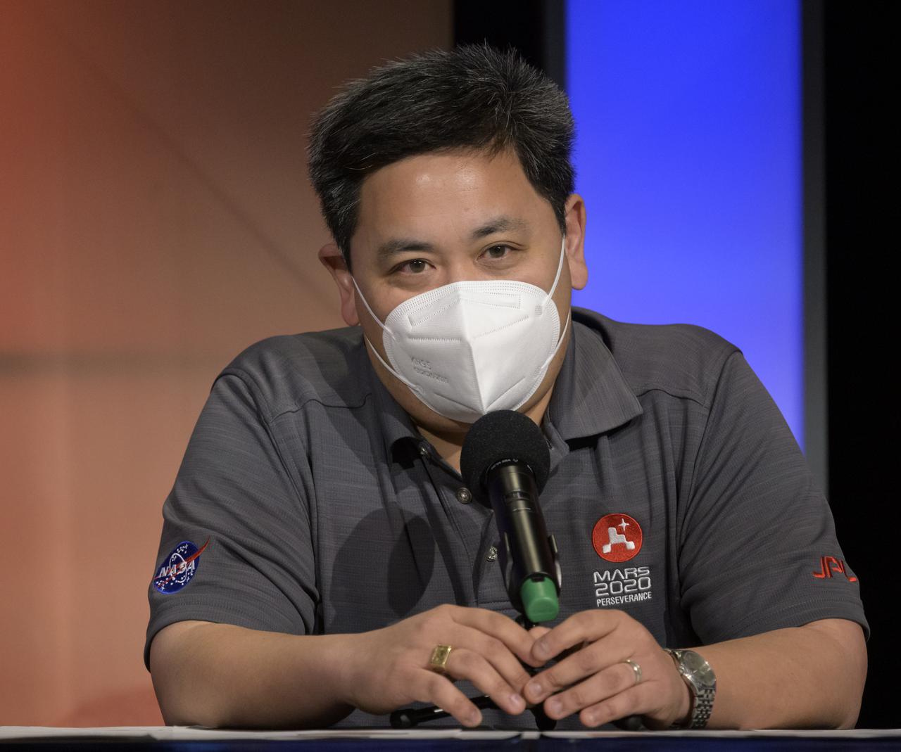 Perseverance entry, descent, and landing lead, JPL, Allen Chen, gives remarks during a NASA Perseverance rover mission landing update, Wednesday, Feb. 17, 2021, at NASA's Jet Propulsion Laboratory in Pasadena, California. The Perseverance Mars rover is due to land on Mars Thursday, Feb. 18, 2021. A key objective for Perseverance’s mission on Mars is astrobiology, including the search for signs of ancient microbial life. The rover will characterize the planet’s geology and past climate, pave the way for human exploration of the Red Planet, and be the first mission to collect and cache Martian rock and regolith. Photo Credit: (NASA/Bill Ingalls)
