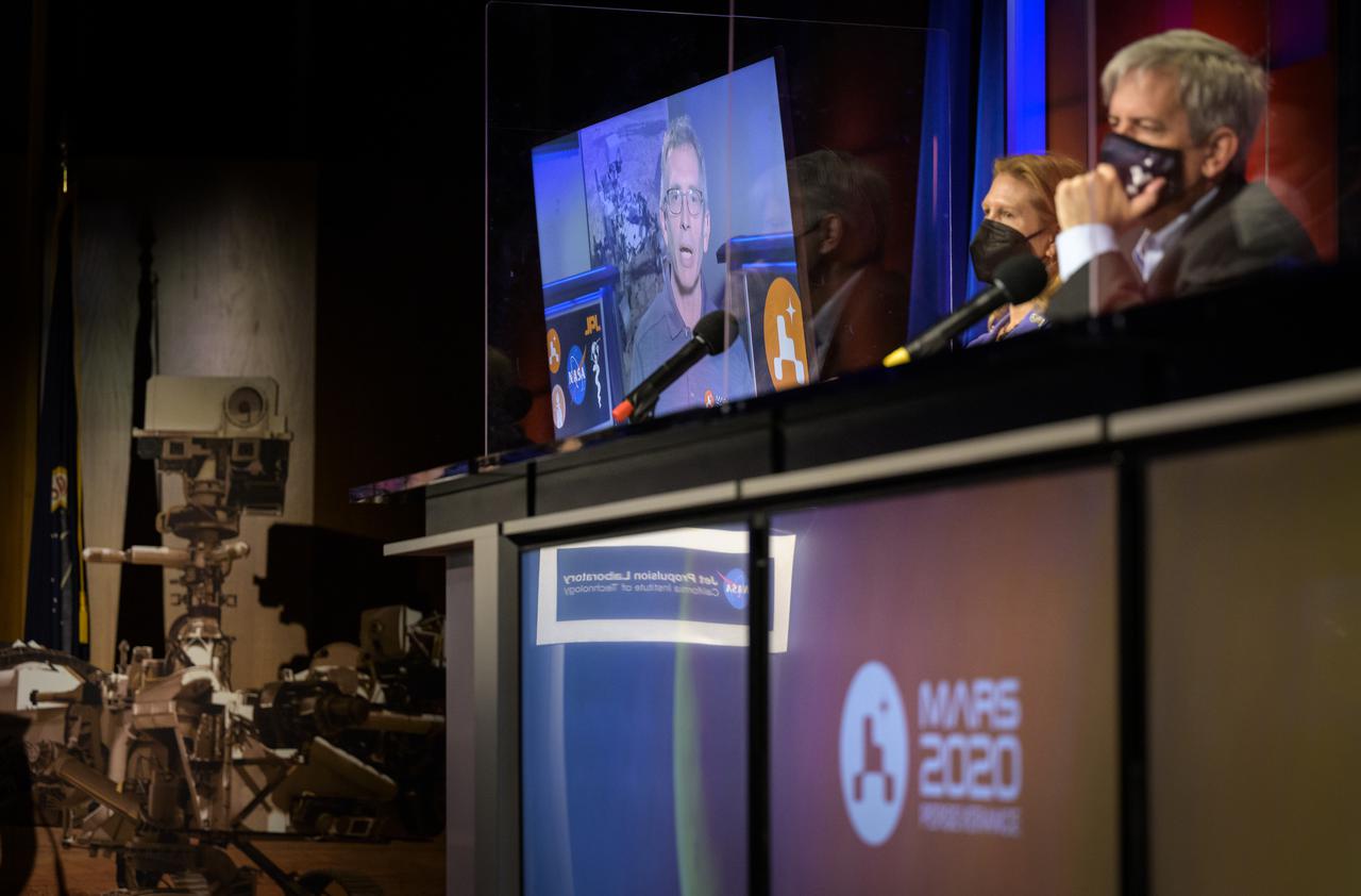 Perseverance project scientist, Caltech, Pasadena, California, Ken Farley, on screen, gives remarks during a NASA Perseverance rover mission landing update, Wednesday, Feb. 17, 2021, at NASA's Jet Propulsion Laboratory in Pasadena, California. The Perseverance Mars rover is due to land on Mars Thursday, Feb. 18, 2021. A key objective for Perseverance’s mission on Mars is astrobiology, including the search for signs of ancient microbial life. The rover will characterize the planet’s geology and past climate, pave the way for human exploration of the Red Planet, and be the first mission to collect and cache Martian rock and regolith. Photo Credit: (NASA/Bill Ingalls)