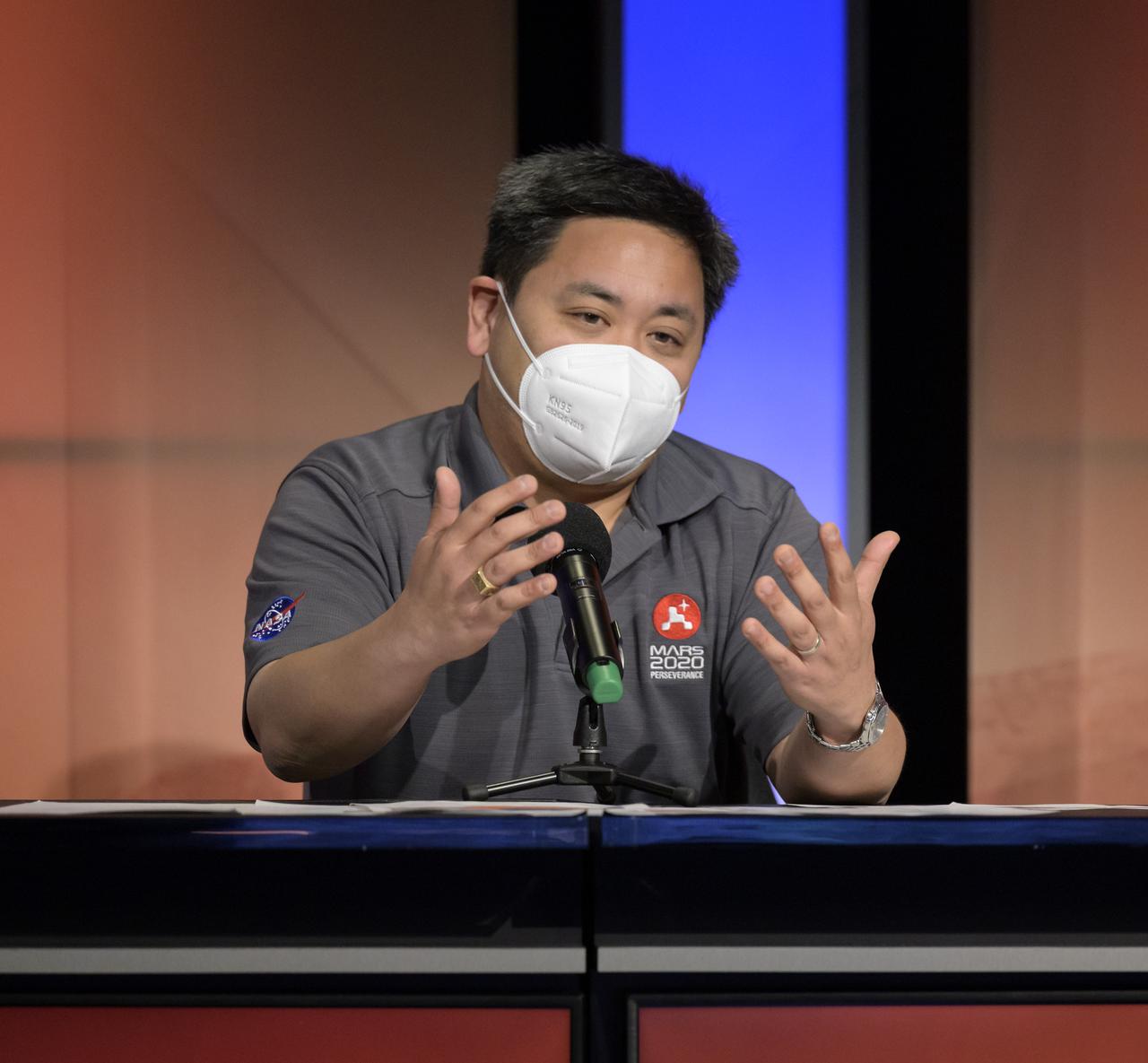 Perseverance entry, descent, and landing lead, JPL, Allen Chen, gives remarks during a NASA Perseverance rover mission landing update, Wednesday, Feb. 17, 2021, at NASA's Jet Propulsion Laboratory in Pasadena, California. The Perseverance Mars rover is due to land on Mars Thursday, Feb. 18, 2021. A key objective for Perseverance’s mission on Mars is astrobiology, including the search for signs of ancient microbial life. The rover will characterize the planet’s geology and past climate, pave the way for human exploration of the Red Planet, and be the first mission to collect and cache Martian rock and regolith. Photo Credit: (NASA/Bill Ingalls)