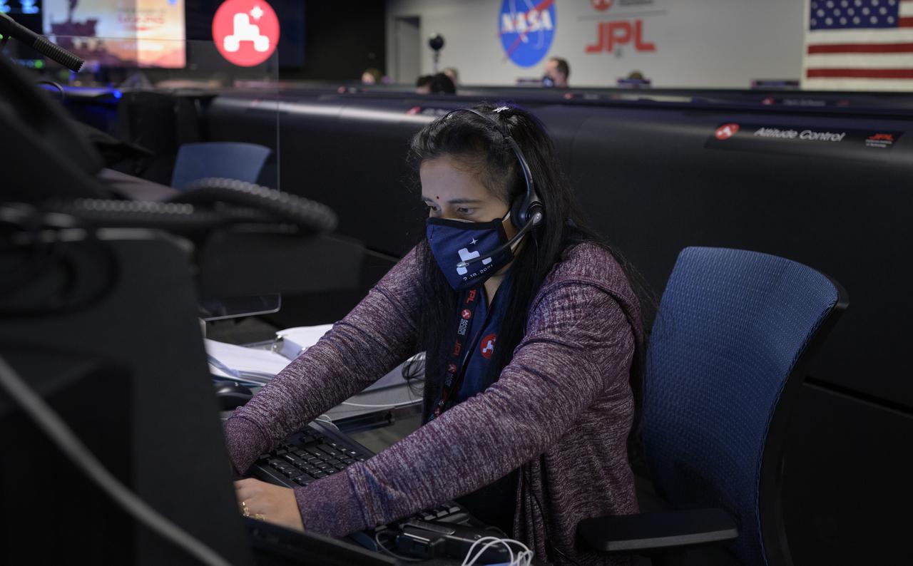 Perseverance Mars rover mission commentator and guidance, navigation, and controls operations Lead Swati Mohan studies data on monitors in mission control, Thursday, Feb. 18, 2021, at NASA's Jet Propulsion Laboratory in Pasadena, California. A key objective for Perseverance’s mission on Mars is astrobiology, including the search for signs of ancient microbial life. The rover will characterize the planet’s geology and past climate, pave the way for human exploration of the Red Planet, and be the first mission to collect and cache Martian rock and regolith. Photo Credit: (NASA/Bill Ingalls)