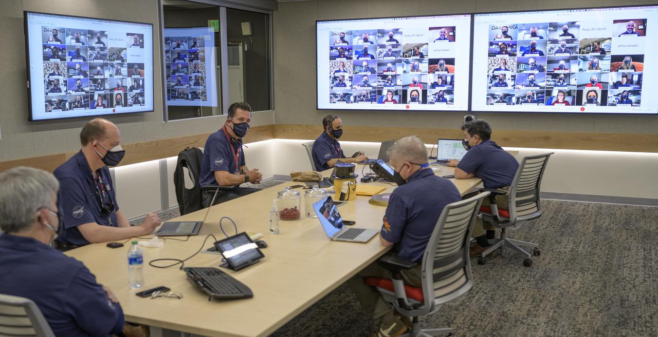 Members of NASA’s Perseverance Mars rover management team meet via remote and in mission control, Thursday, Feb. 18, 2021, at NASA's Jet Propulsion Laboratory in Pasadena, California. A key objective for Perseverance’s mission on Mars is astrobiology, including the search for signs of ancient microbial life. The rover will characterize the planet’s geology and past climate, pave the way for human exploration of the Red Planet, and be the first mission to collect and cache Martian rock and regolith. Photo Credit: (NASA/Bill Ingalls)