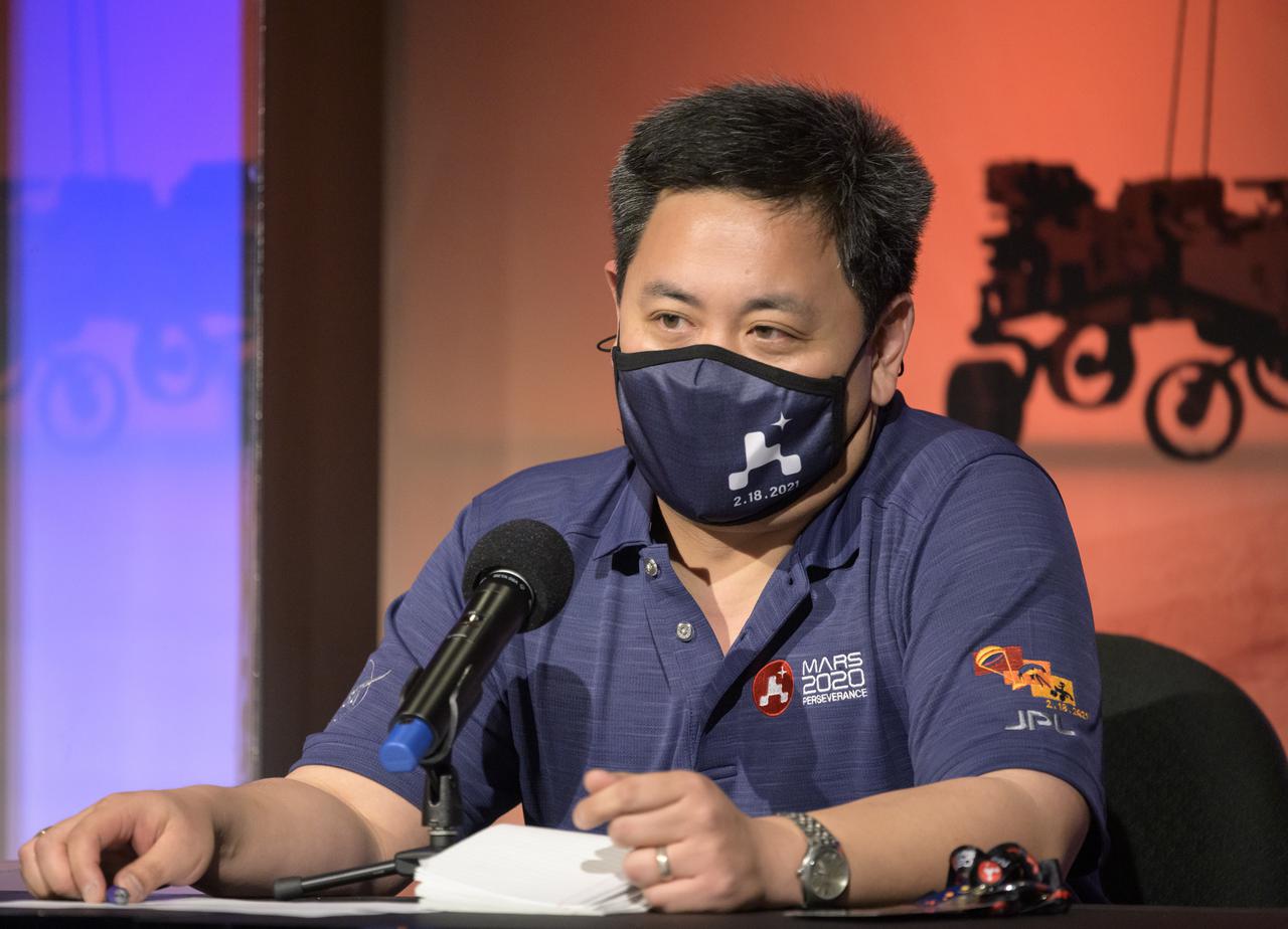 Perseverance entry, descent, and landing phase lead Allen Chen, gives remarks during a NASA Perseverance rover mission post-landing update, Thursday, Feb. 18, 2021, at NASA's Jet Propulsion Laboratory in Pasadena, California. A key objective for Perseverance’s mission on Mars is astrobiology, including the search for signs of ancient microbial life. The rover will characterize the planet’s geology and past climate, pave the way for human exploration of the Red Planet, and be the first mission to collect and cache Martian rock and regolith. Photo Credit: (NASA/Bill Ingalls)
