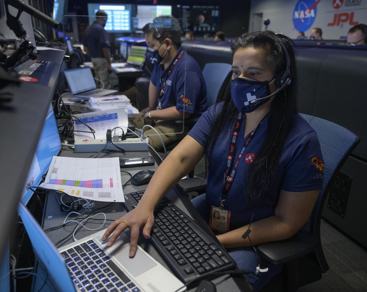 NASA’s Perseverance Mars rover mission commentator and guidance, navigation, and controls operations Lead Swati Mohan studies data in mission control, Thursday, Feb. 18, 2021, at NASA's Jet Propulsion Laboratory in Pasadena, California. A key objective for Perseverance’s mission on Mars is astrobiology, including the search for signs of ancient microbial life. The rover will characterize the planet’s geology and past climate, pave the way for human exploration of the Red Planet, and be the first mission to collect and cache Martian rock and regolith. Photo Credit: (NASA/Bill Ingalls)