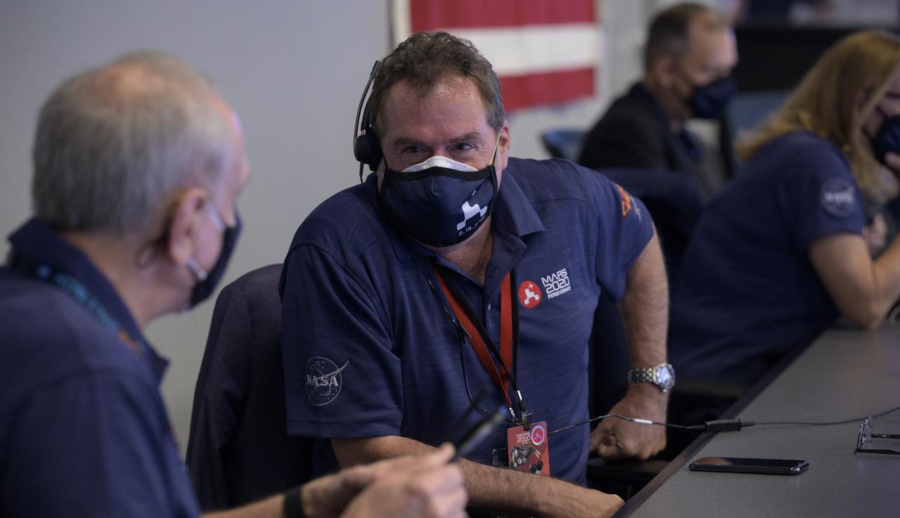 JPL Director Michael Watkins, right, talks with Acting NASA Administrator Steve Jurczyk as they and the NASA Perseverance Mars rover team await the landing of the spacecraft in mission control, Thursday, Feb. 18, 2021, at NASA's Jet Propulsion Laboratory in Pasadena, California. A key objective for Perseverance’s mission on Mars is astrobiology, including the search for signs of ancient microbial life. The rover will characterize the planet’s geology and past climate, pave the way for human exploration of the Red Planet, and be the first mission to collect and cache Martian rock and regolith. Photo Credit: (NASA/Bill Ingalls)