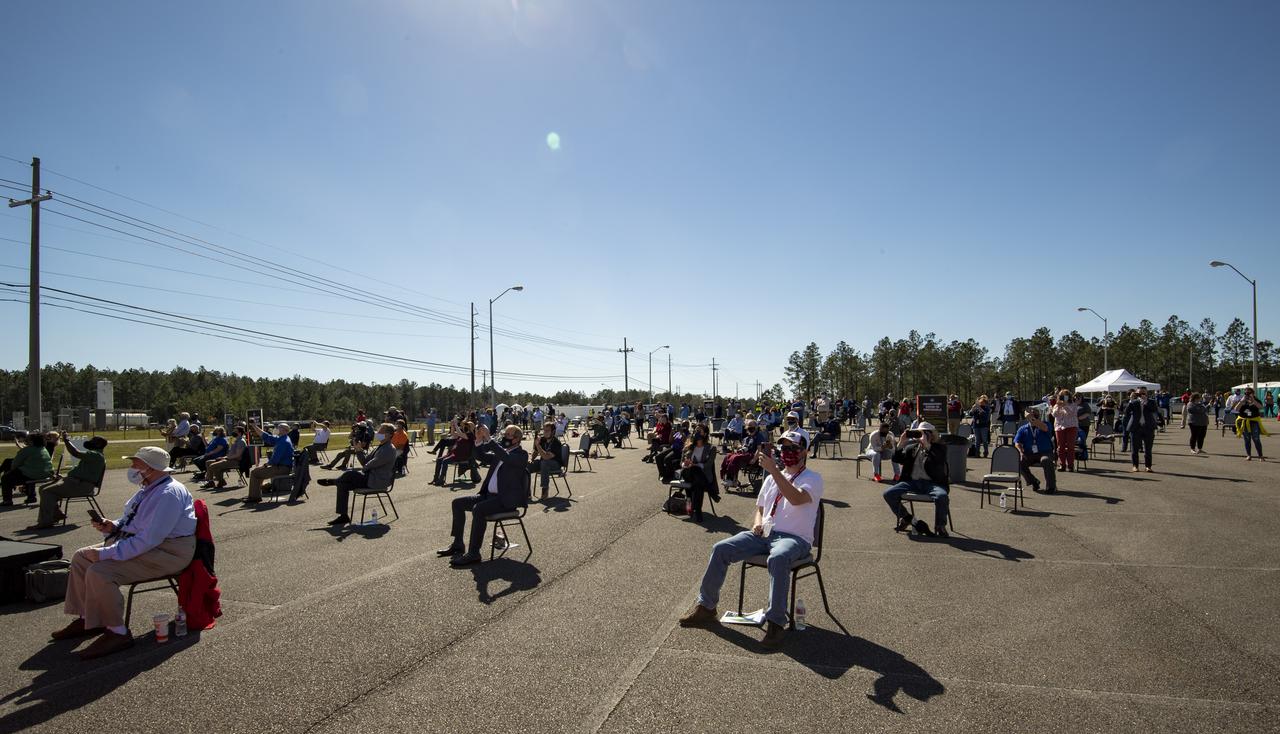 Invited guests watch as the core stage for the first flight of NASA’s Space Launch System rocket undergoes a second hot fire test in the B-2 Test Stand, Thursday, March 18, 2021, at NASA’s Stennis Space Center near Bay St. Louis, Mississippi. The four RS-25 engines fired for the full-duration of 8 minutes during the test and generated 1.6 million pounds of thrust. The hot fire test is the final stage of the Green Run test series, a comprehensive assessment of the Space Launch System’s core stage prior to launching the Artemis I mission to the Moon.  Photo Credit: (NASA/Robert Markowitz)