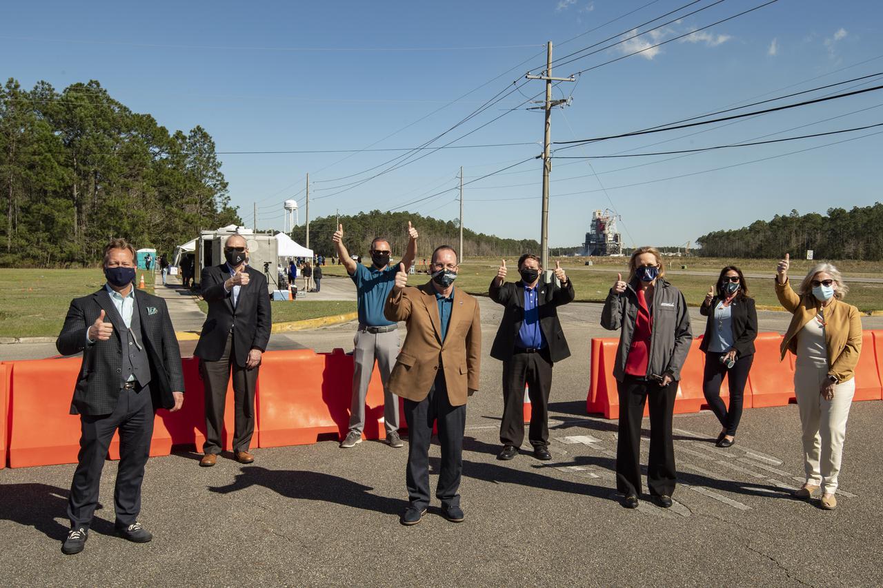 From left: Jim Maser, senior vice president of the Space Business Unit of Aerojet Rocketdyne; acting NASA Administrator Steve Jurzyck; John Bailey, associate director of NASA's Stennis Space Center; Rick Gilbrech, director of NASA's Stennis Space Center; Mike McDaniel, general manager of Aerojet Rocketdyne at Stennis Space Center; Amy Growder, chief operating officer of Aerojet Rocketdyne; Mary Byrd, associate director of NASA’s Marshall Space Flight Center; and Jody Singer, director of NASA's Marshall Space Flight Center; pose for a picture giving a thumbs-up following a second hot fire test of the core stage for the first flight of NASA’s Space Launch System rocket in the B-2 Test Stand, Thursday, March 18, 2021, at NASA’s Stennis Space Center near Bay St. Louis, Mississippi. The four RS-25 engines fired for the full-duration of 8 minutes during the test and generated 1.6 million pounds of thrust. The hot fire test is the final stage of the Green Run test series, a comprehensive assessment of the Space Launch System’s core stage prior to launching the Artemis I mission to the Moon.  Photo Credit: (NASA/Robert Markowitz)